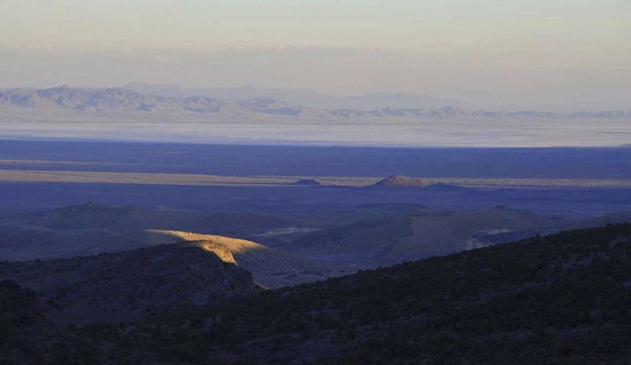 A ray of sunlight peeks through clouds above western Utah’s House Range just north of Sevier Lake in Millard County. Environmentalists filed a lawsuit on Monday to prevent the construction of a new potash mine that they say would devastate a lake ecosystem in the drought-stricken western Utah desert.