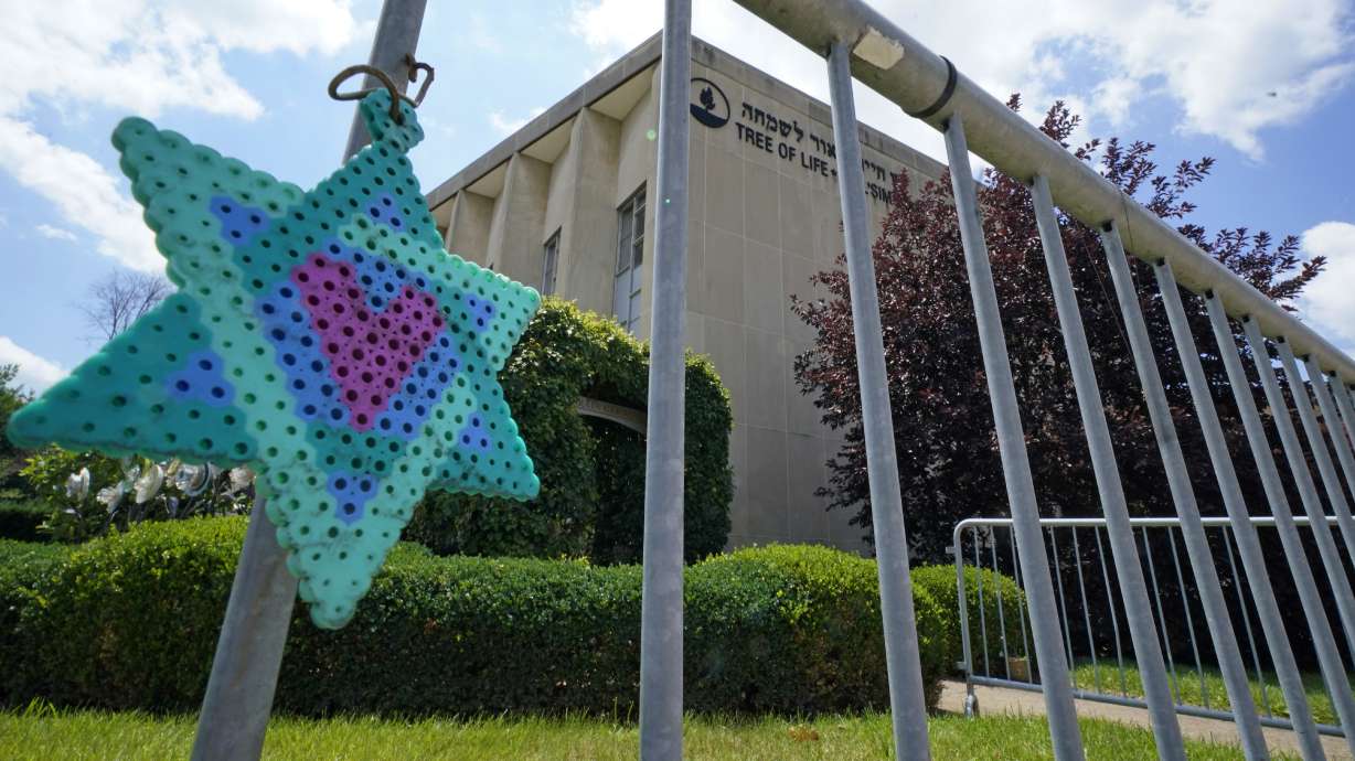A Star of David hangs from a fence outside the dormant landmark Tree of Life synagogue in Pittsburgh's Squirrel Hill neighborhood on July 13. A jury recommended Wednesday that Robert Bowers, who killed 11 worshippers in 2018, be put to death.