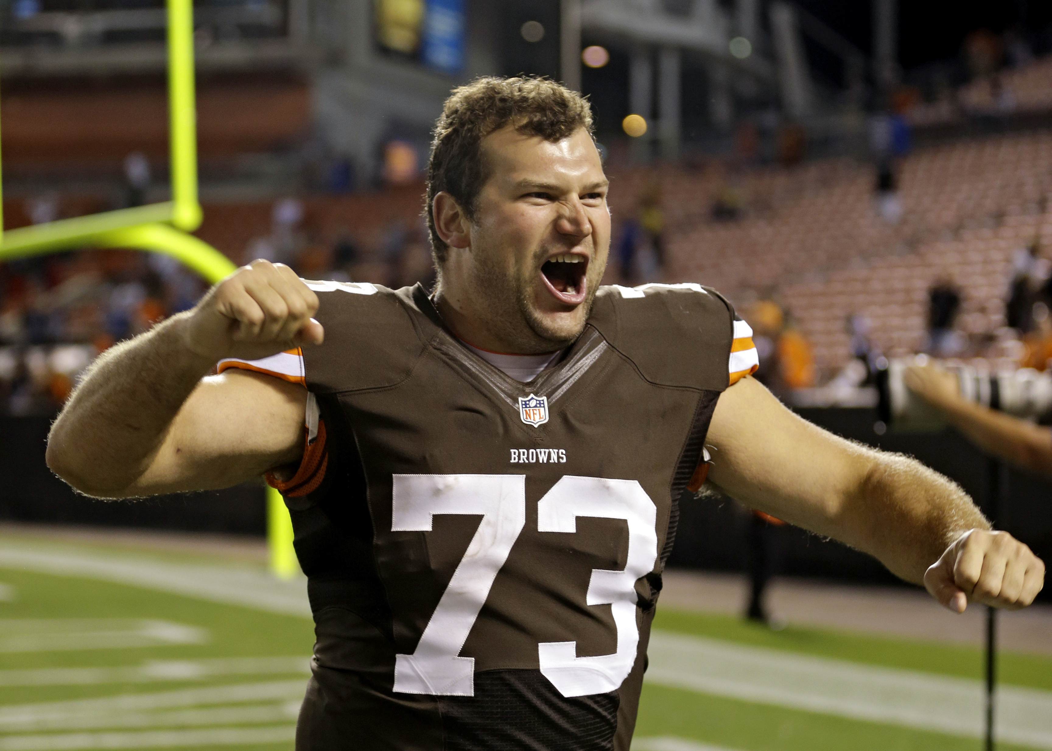 FILE - Cleveland Browns tackle Joe Thomas celebrates after a 24-6 win over the Detroit Lions in a preseason NFL football game in Cleveland. Aug. 15, 2013. Elected for enshrinement in his first year of eligibility, Joe Thomas will be introduced by his wife, Annie, and their four children, before he's the fitting closing speaker on Saturday in Tom Benson Hall of Fame Stadium, which will be overrun by Browns fans.