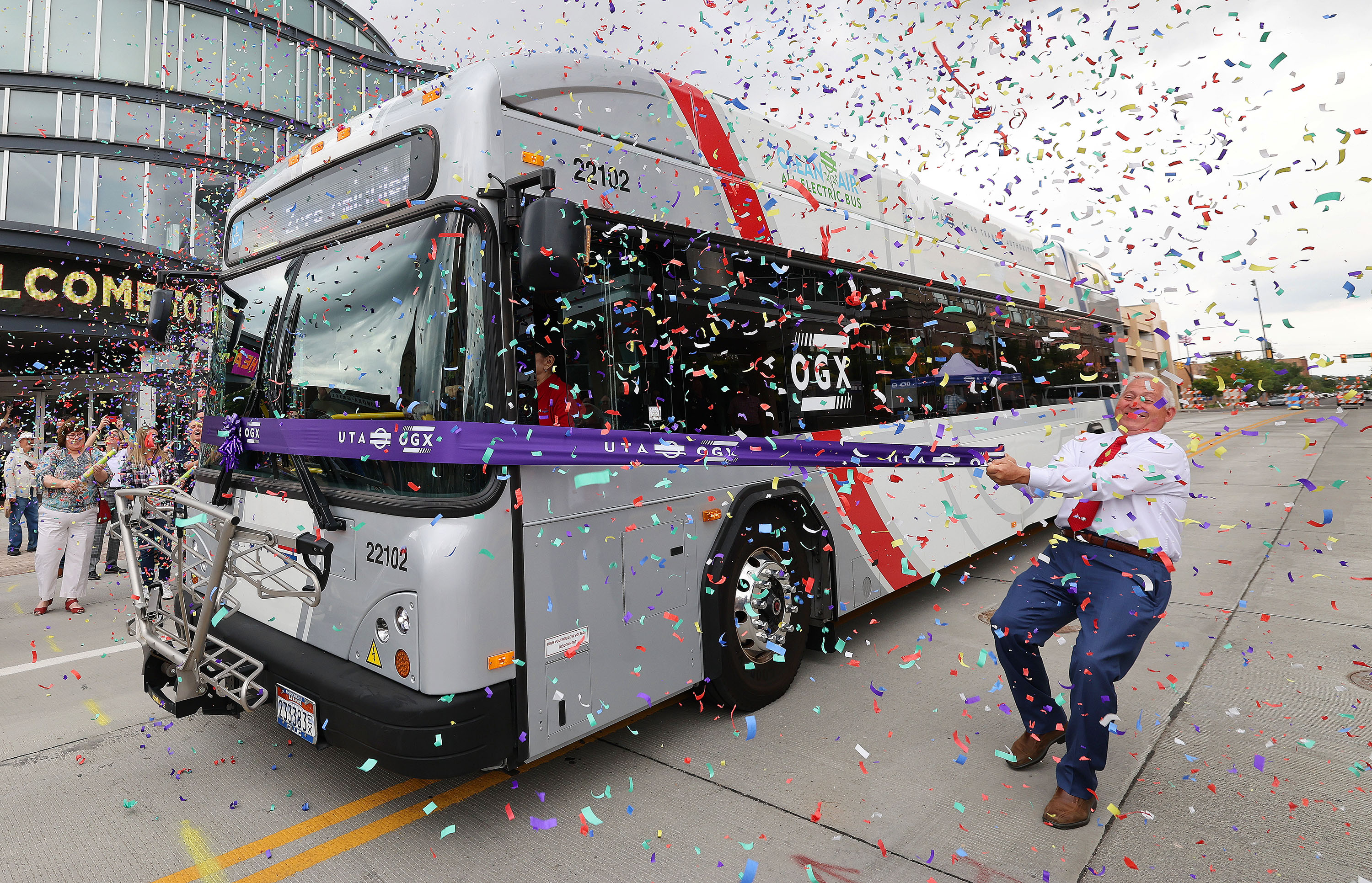 Utah Transit Authority trustee Jeff Acerson tries to hold a ribbon that won’t break during a ribbon-cutting for the new Ogden Express in Ogden on Wednesday. The ribbon-cutting for OGX marks the end of more than 20 years of planning in Ogden.
