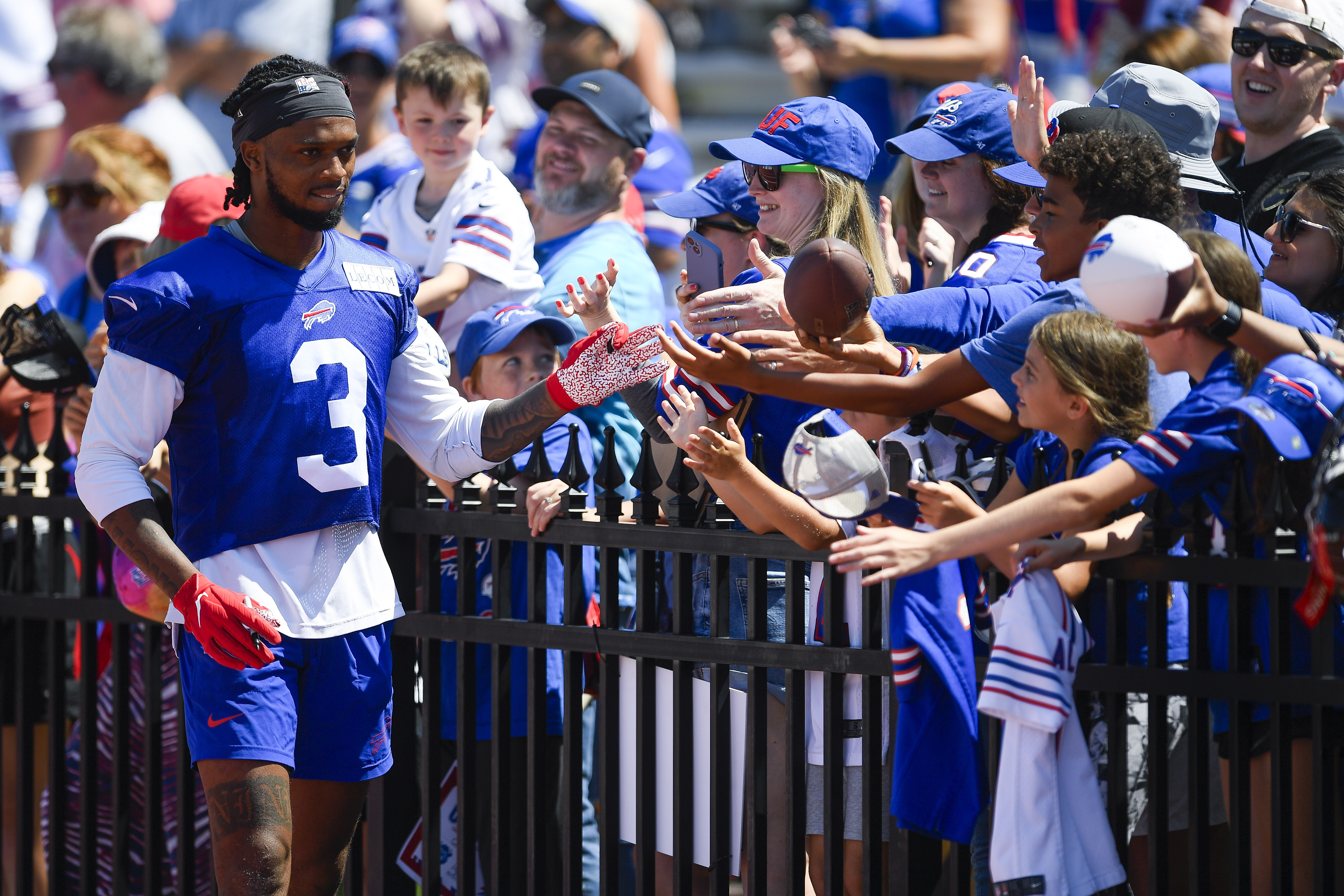 FILE - Buffalo Bills safety Damar Hamlin (3) greets fans after practice at the NFL football team's training camp in Pittsford, N.Y., Sunday, July 30, 2023. Hamlin announced Wednesday, Aug. 2, that he will expand his efforts to promote charitable giving by supporting a company that allows donors to give to nonprofits immediately, while actually paying later — the Buffalo Bills safety's latest move to direct the outpouring of support he received after collapsing on the field during a game in January. 