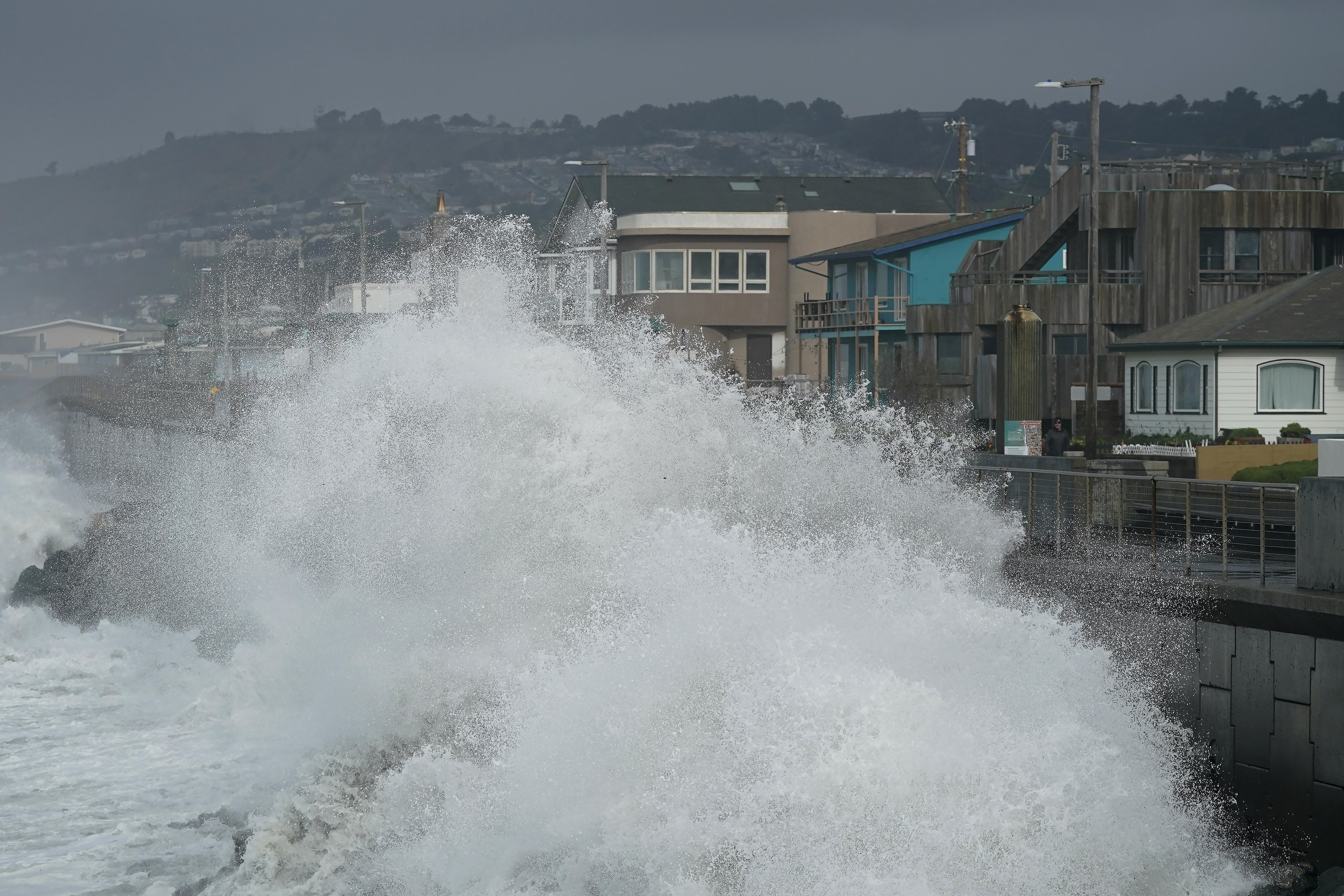 Large waves crash into a seawall in Pacifica, Calif., on Jan. 6. Giant waves, measuring as high as 13 feet, are becoming more common off California's Pacific coast as the planet warms, according to new research.