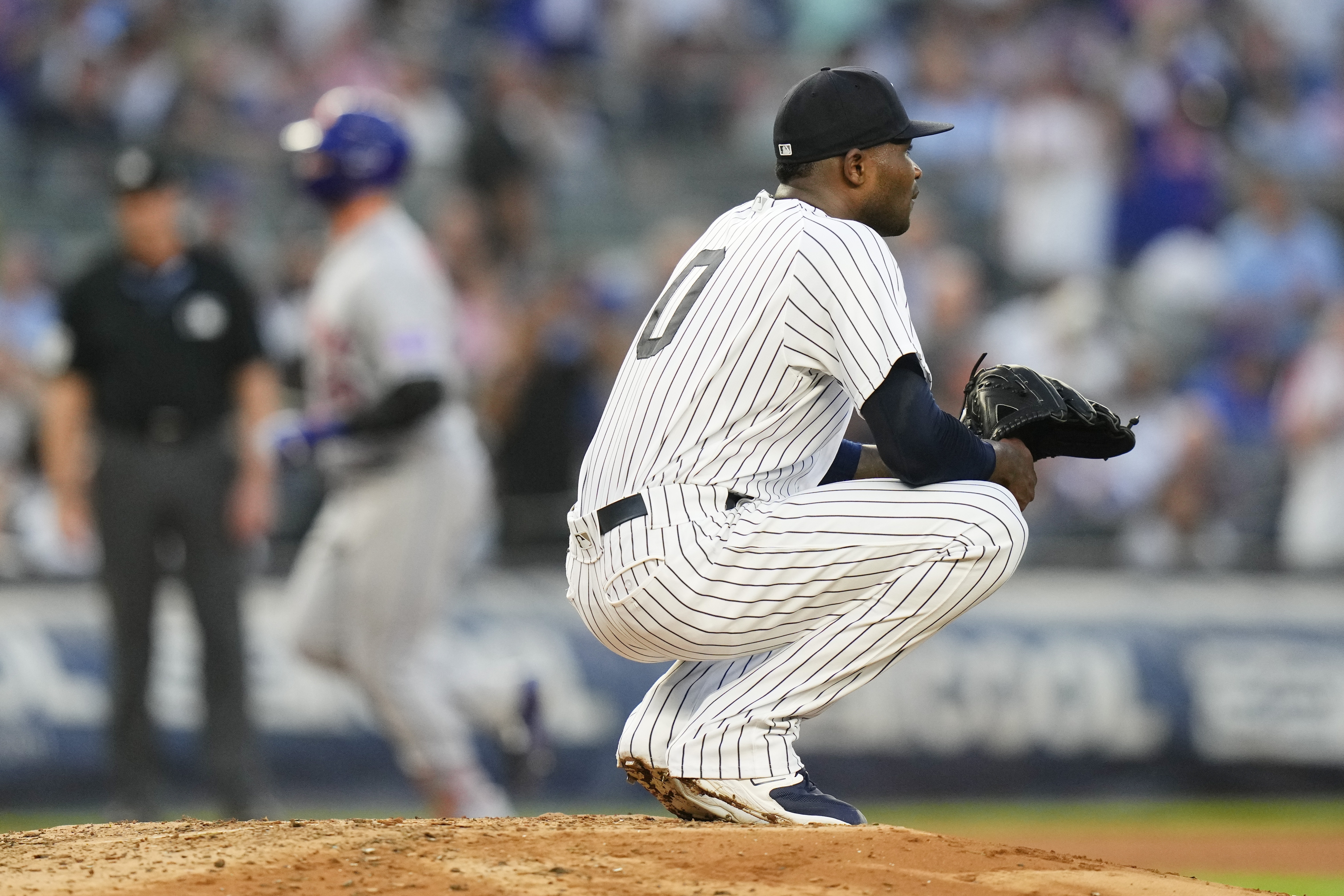 New York Yankees starting pitcher Domingo German (0) reacts as New York Mets' Pete Alonso runs the bases after hitting a three-run home run during the third inning of a baseball game, Tuesday, July 25, 2023, in New York.
