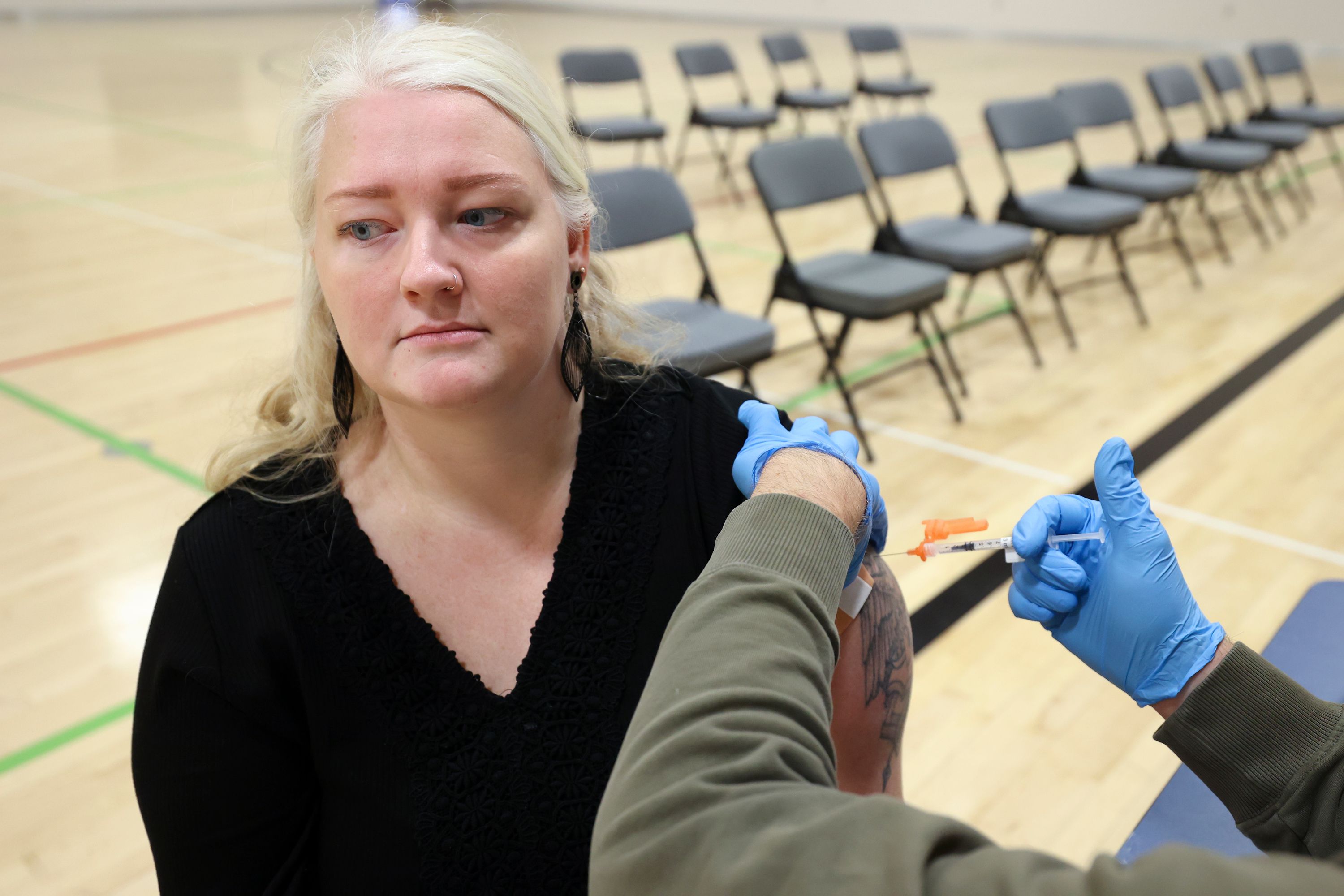 Jasi Sefcik gets a COVID-19 booster shot during a free vaccine clinic at the Sanderson Community Center in Taylorsville on Nov. 9, 2022. COVID-19 indicators are creeping back up this summer. 