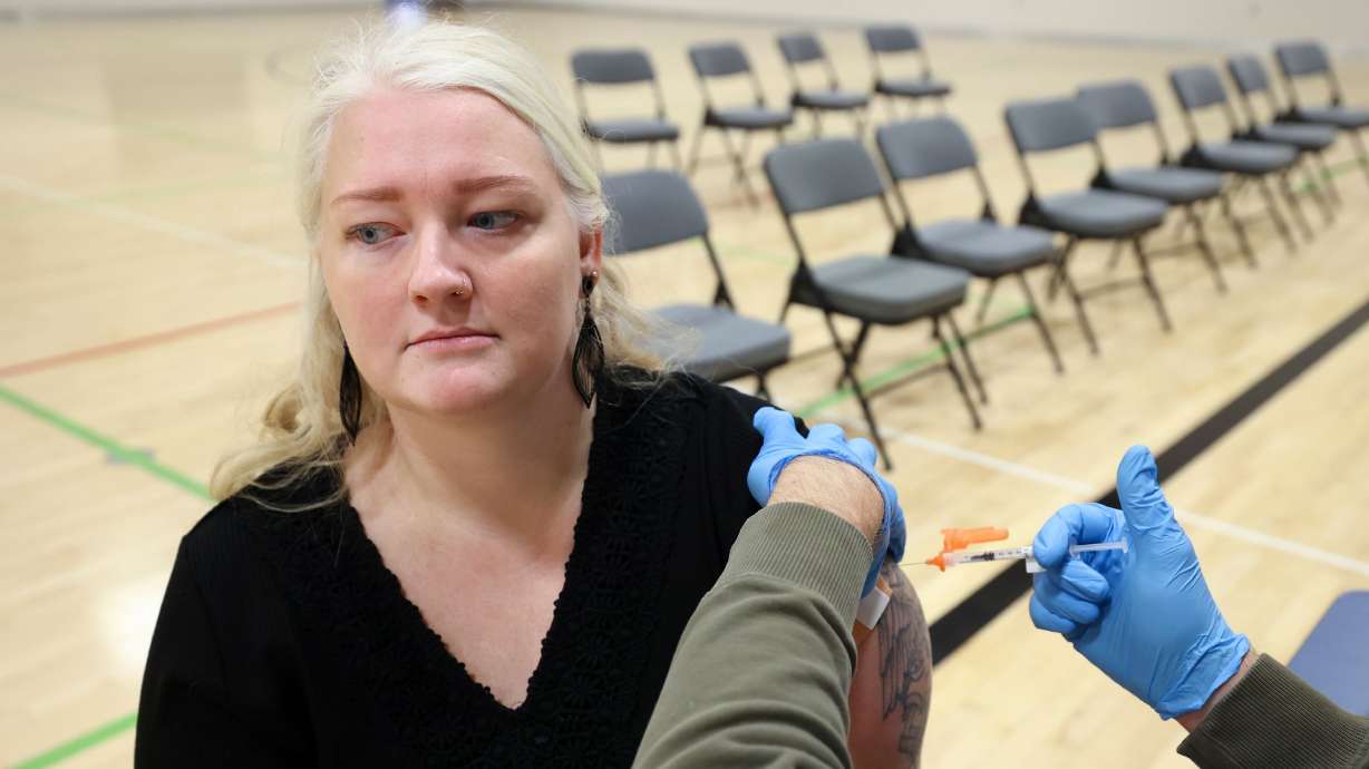 Jasi Sefcik gets a COVID-19 booster shot during a free vaccine clinic at the Sanderson Community Center in Taylorsville on Nov. 9, 2022. COVID-19 indicators are creeping back up this summer.