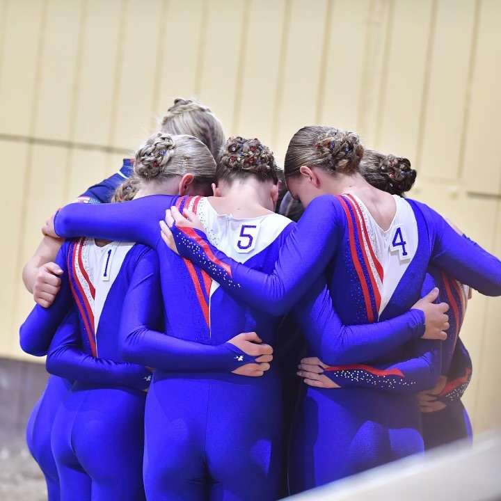 Utah-based Team USA's junior squad hug before they compete. The squad placed third in the 2023 FEI World Championship for Young Vaulters on July 30.