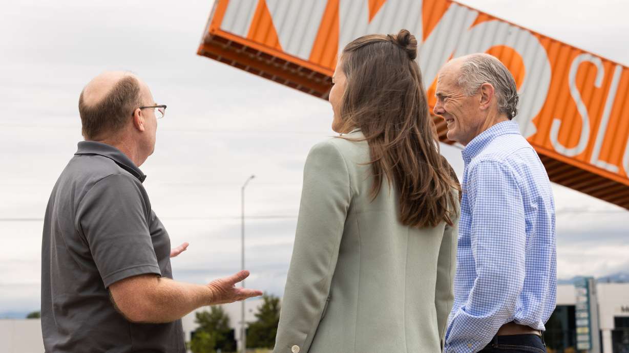 Left to right, Jerel Newsman, structural engineer, talks to Salt Lake City Mayor Erin Mendenhall and Councilman Dan Dugan at the unveiling of Salt Lake City’s newest public art piece in the Northwest Quadrant of Salt Lake City on Thursday.