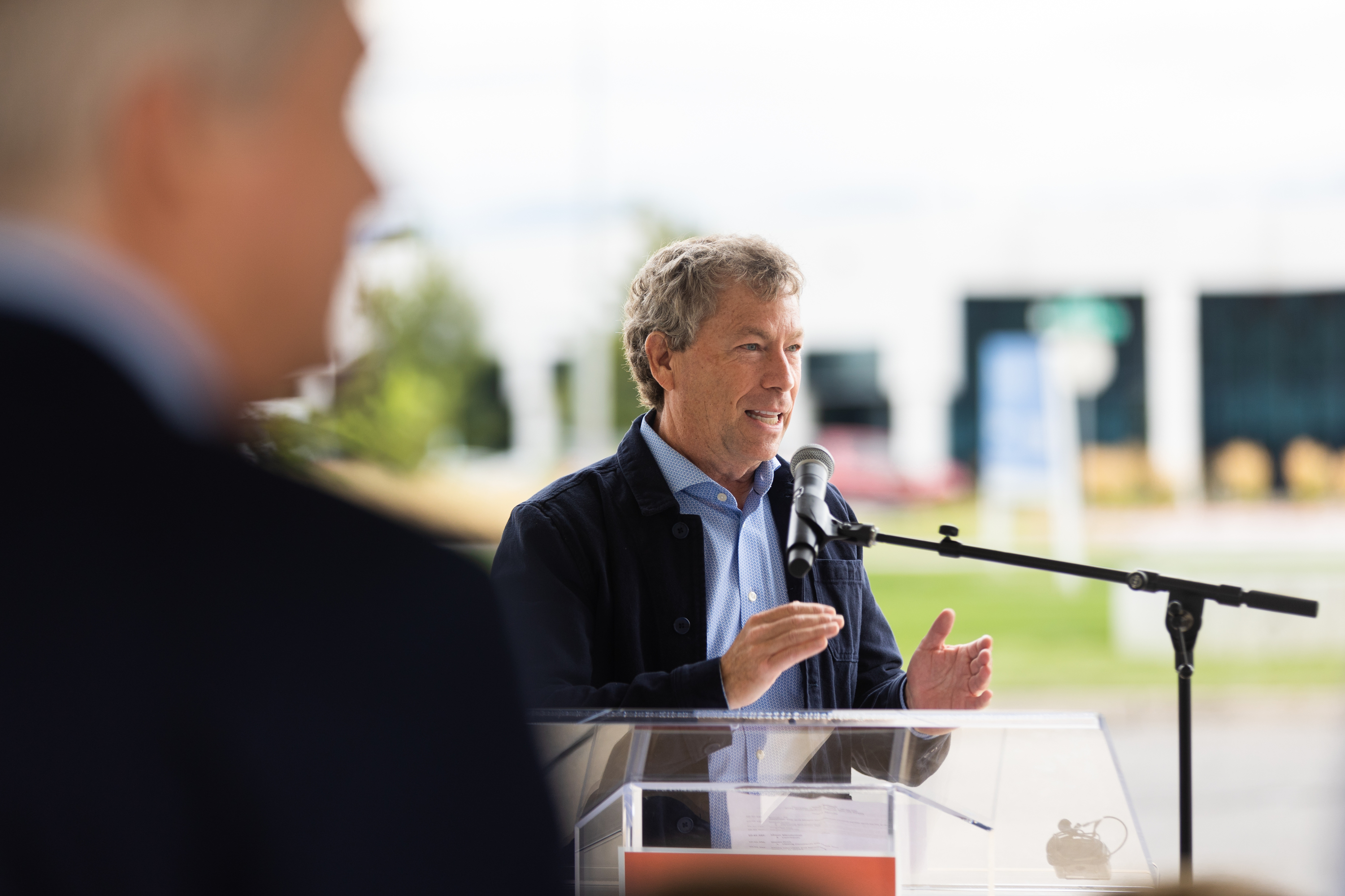 Steven Price welcomes attendees to the unveiling of Salt Lake City’s newest public art piece in the Northwest Quadrant of Salt Lake City on Thursday. Partnering with Utah-based Tri Square Fabrication, Price commissioned the custom fabrication of nine shipping containers, which have been installed throughout Salt Lake County.