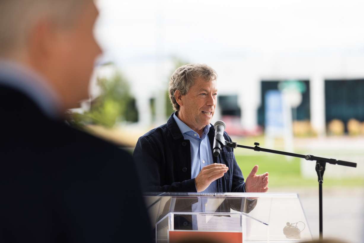 Steven Price welcomes attendees to the unveiling of Salt Lake City’s newest public art piece in the Northwest Quadrant of Salt Lake City on Thursday. Partnering with Utah-based Tri Square Fabrication, Price commissioned the custom fabrication of nine shipping containers, which have been installed throughout Salt Lake County.