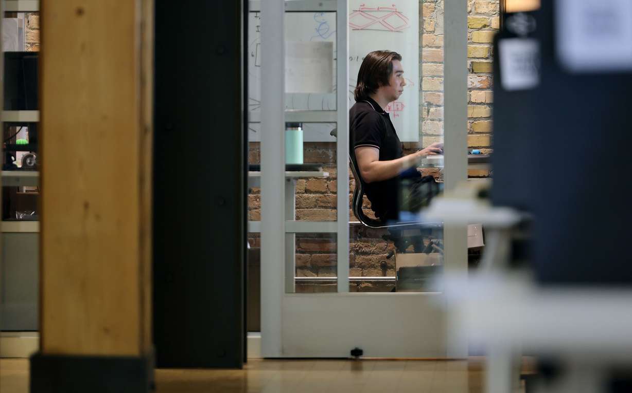 Samuel Campbell of Transit Scientific works on his computer at Work Hive in Salt Lake City on Tuesday.