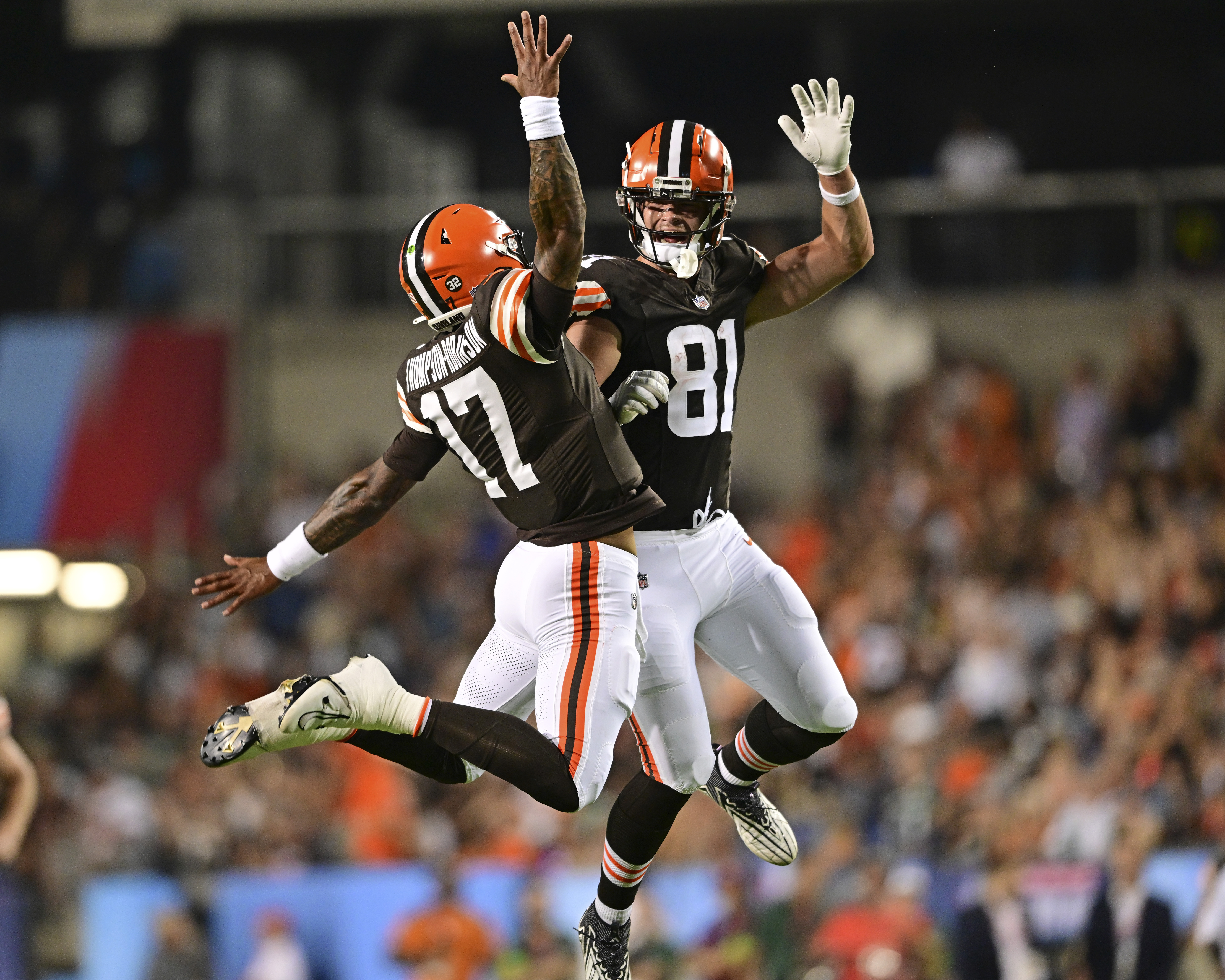 Cleveland Browns quarterback Dorian Thompson-Robinson (17) and tight end Thomas Greaney celebrate a rushing touchdown against the New York Jets by running back Demetric Felton Jr. during the second half of the Hall of Fame NFL football preseason game Thursday, Aug. 3, 2023, in Canton, Ohio.