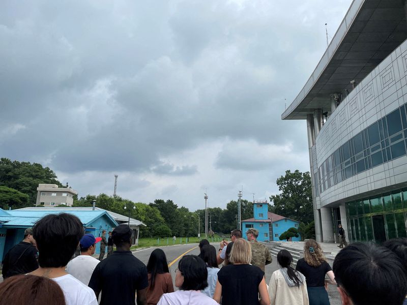 U.S. Private Travis T. King (wearing a black shirt and black cap) is seen in this picture taken during a tour of the tightly controlled Joint Security Area on the border between the two Koreas, at the truce village of Panmunjom, South Korea, July 18.