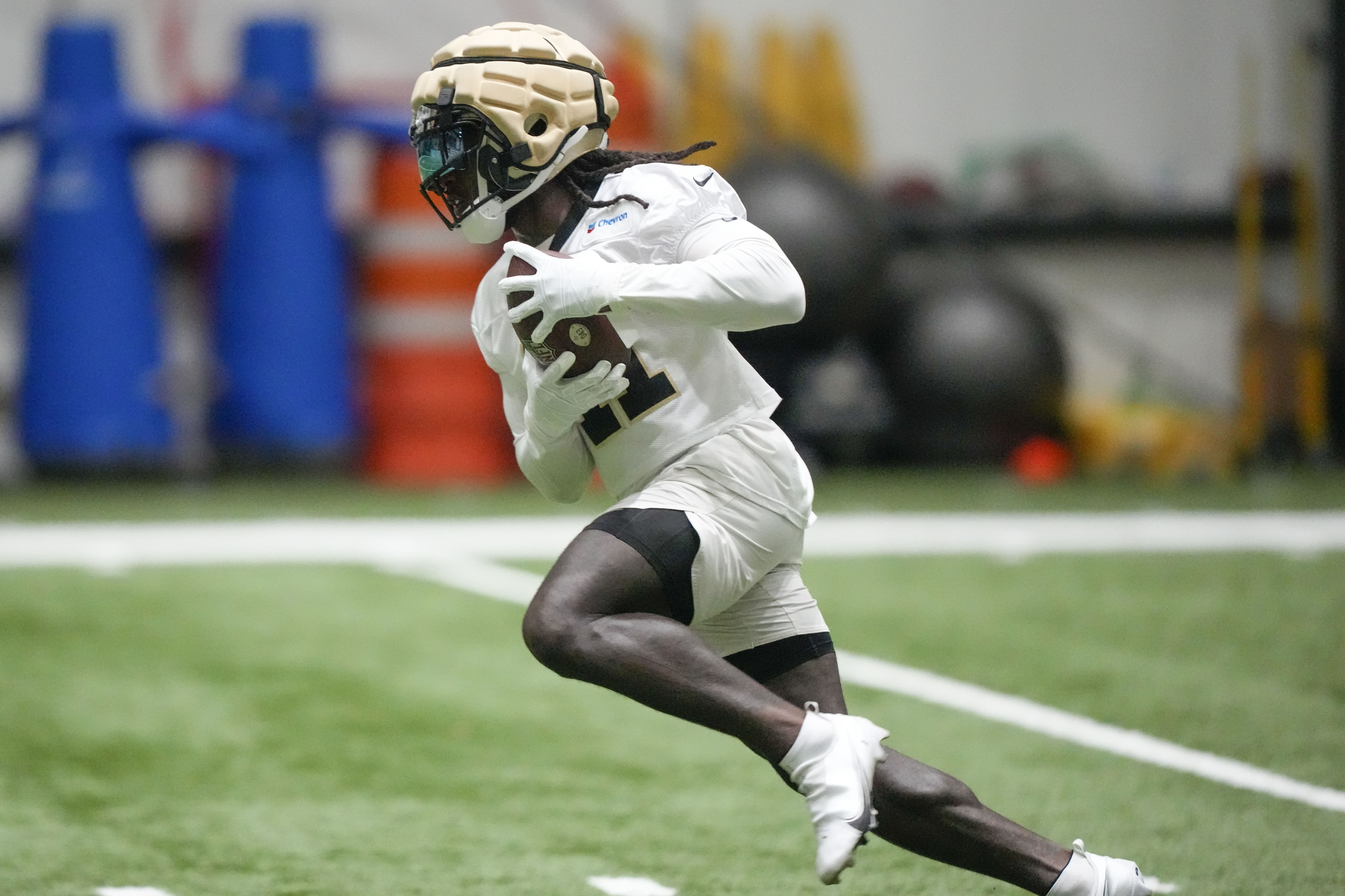 New Orleans Saints running back Alvin Kamara (41) runs through drills at the NFL team's football training camp in Metairie, La., Friday, Aug. 4, 2023. 