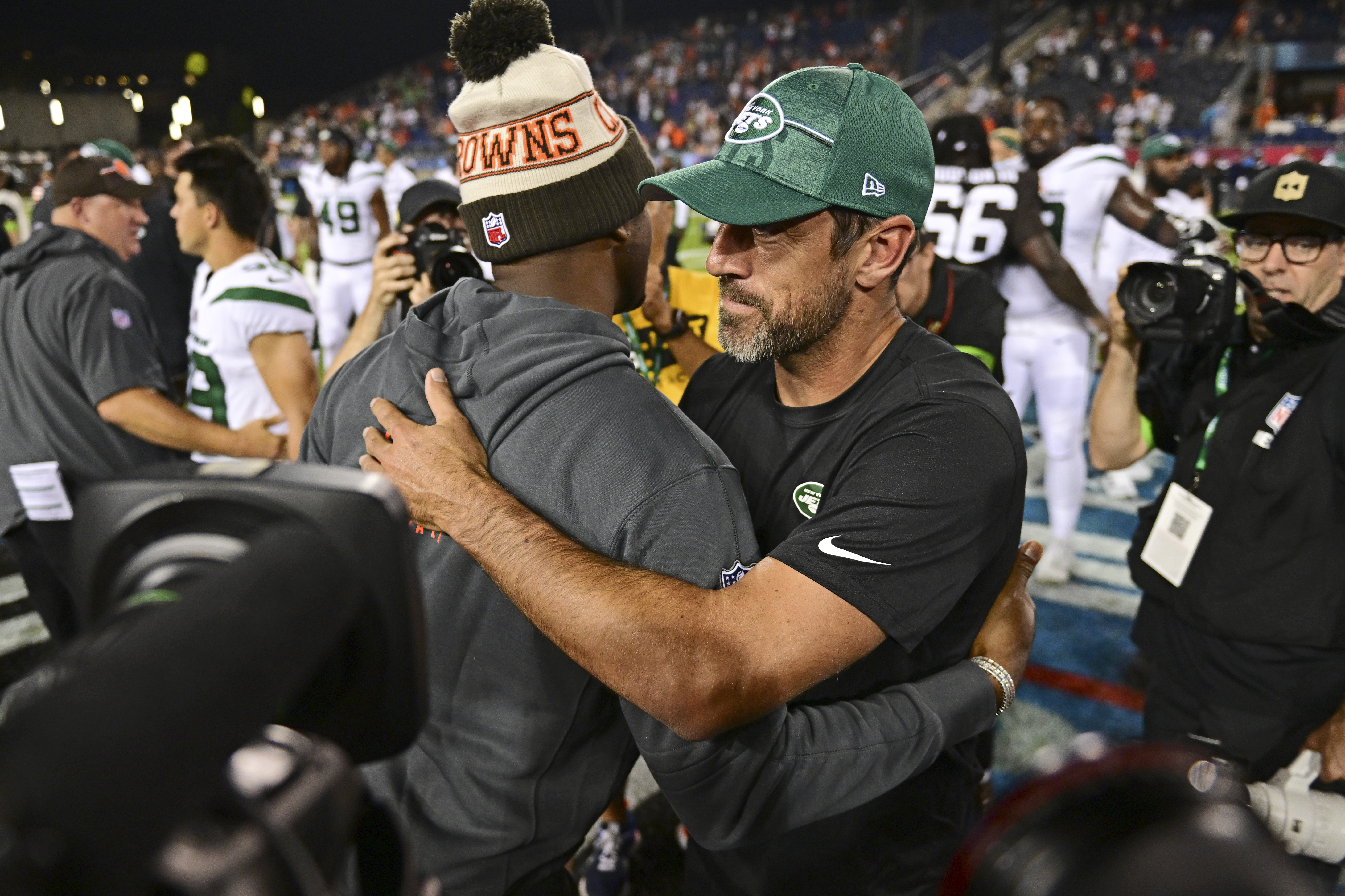 New York Jets quarterback Aaron Rodgers, right, and Cleveland Browns quarterback Deshaun Watson embrace following the Hall of Fame NFL football preseason game Thursday, Aug. 3, 2023, in Canton, Ohio. The Browns won 21-16.
