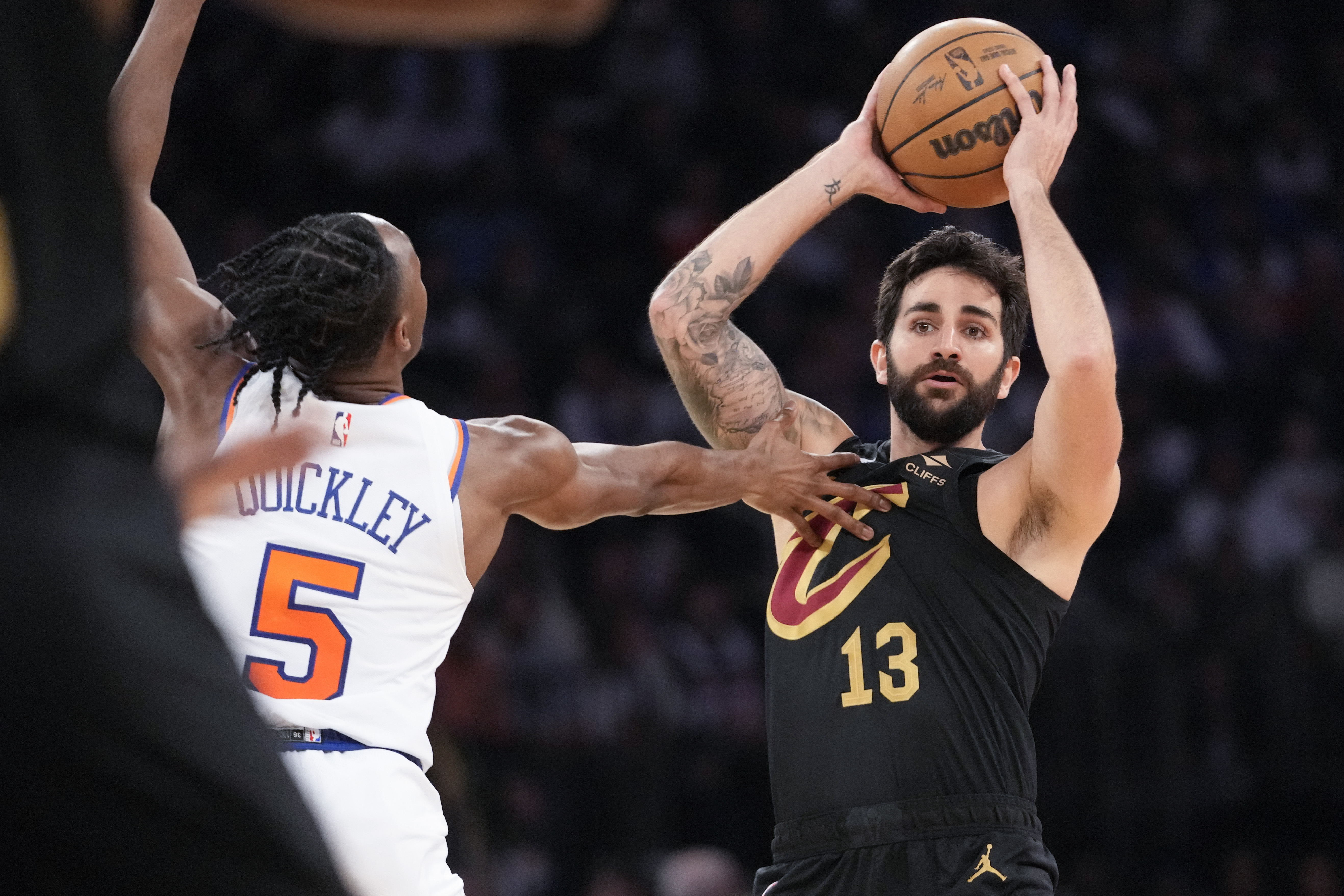 FILE - Cleveland Cavaliers guard Ricky Rubio looks to move the ball around New York Knicks guard Immanuel Quickley (5) in the first half of Game 4 in an NBA basketball first-round playoff series, April 23, 2023, at Madison Square Garden in New York. Rubio announced on Saturday, Aug. 5, that he is taking a break from basketball to focus on his mental health, a move that comes as his Spanish national team prepares to defend its title at the FIBA World Cup that starts later this month. 