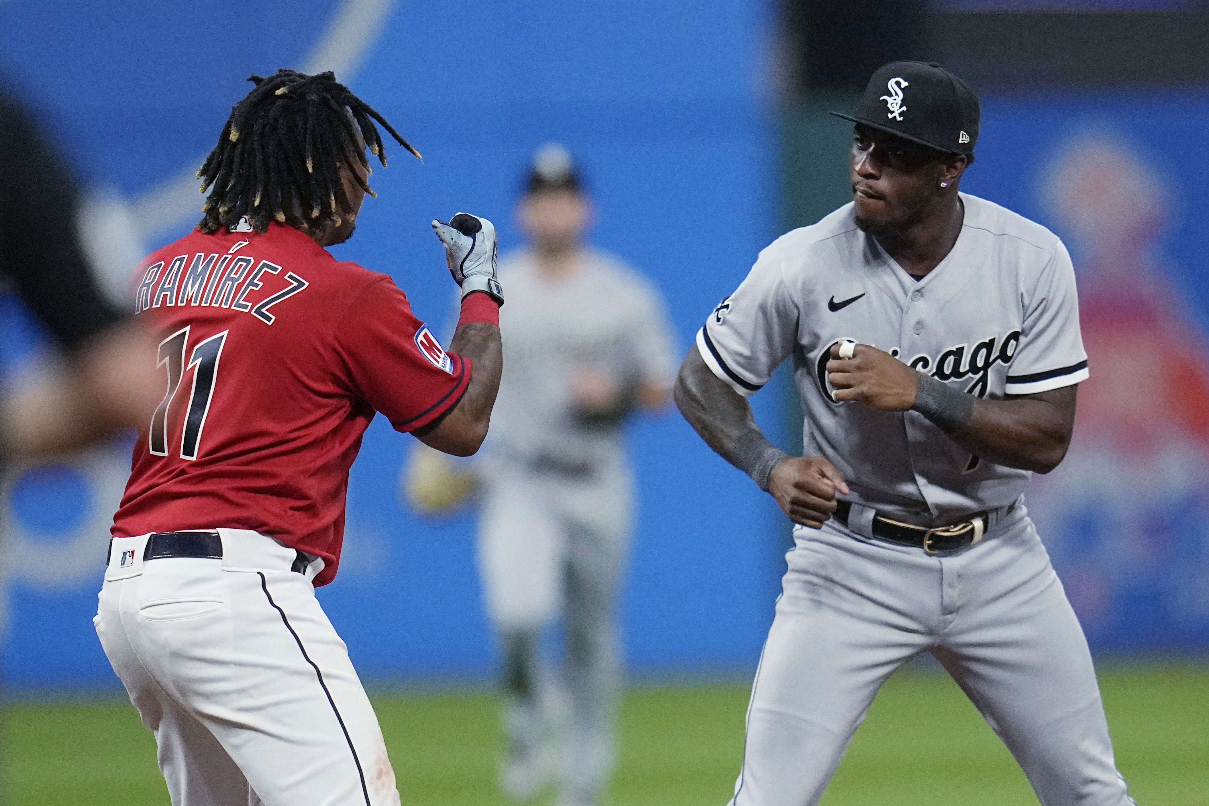 Cleveland Guardians' Jose Ramírez (11) and Chicago White Sox's Tim Anderson, right, square off during the sixth inning of a baseball game Saturday, Aug. 5, 2023, in Cleveland. 