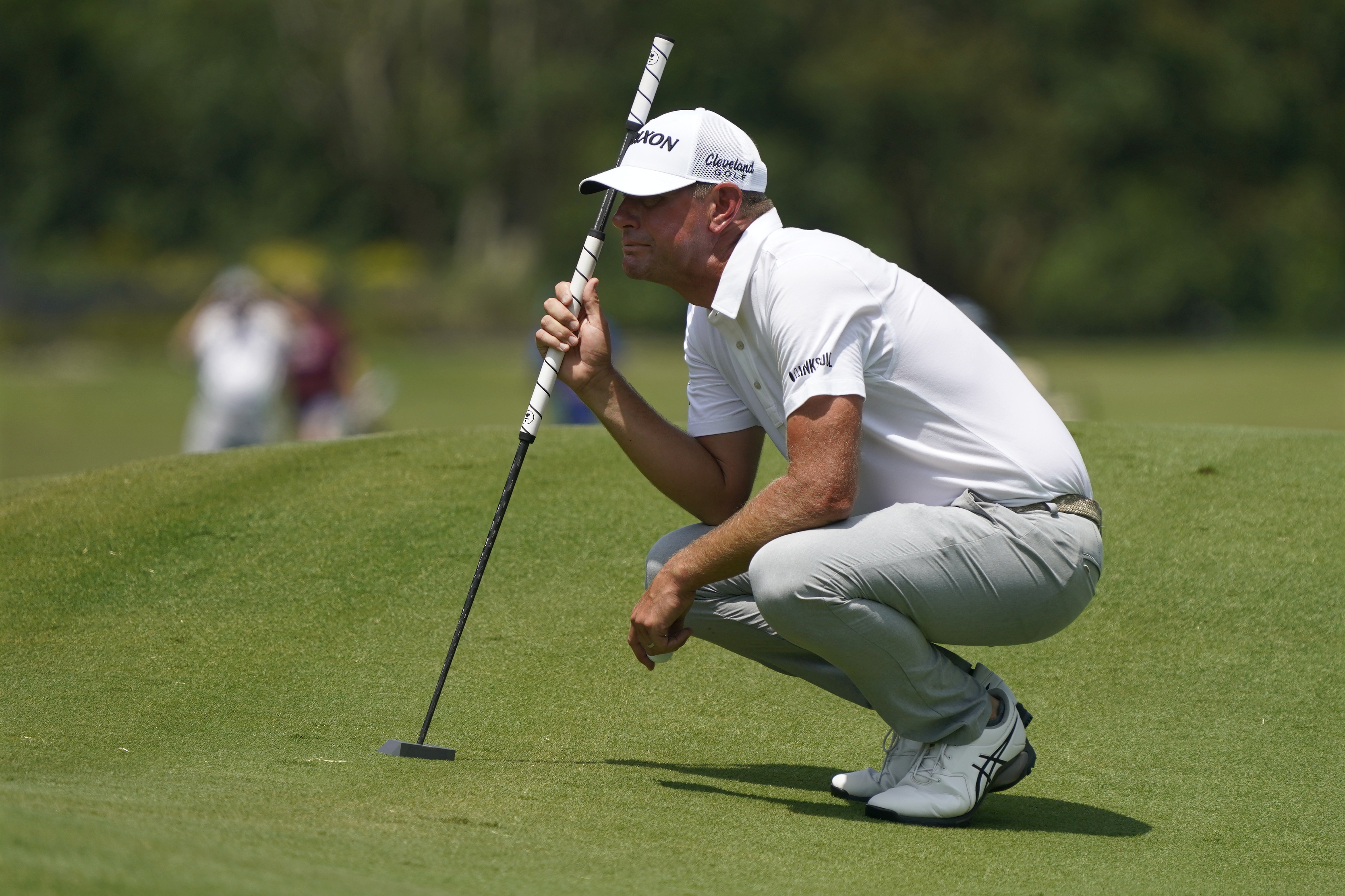 Lucas Glover lines up a putt on the first hole during the final round of the Wyndham Championship golf tournament in Greensboro, N.C., Sunday, Aug. 6, 2023. 