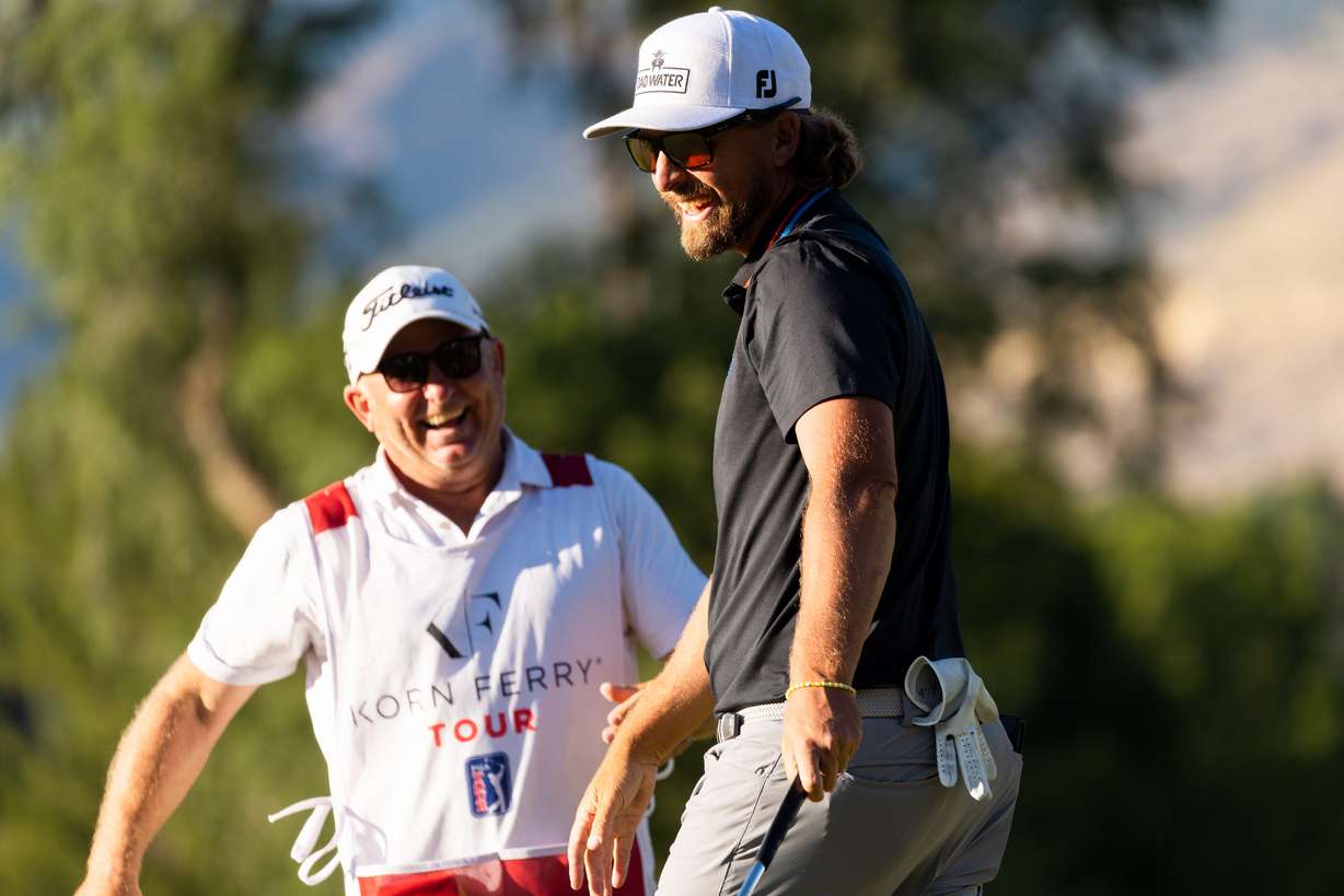 Roger Sloan and his caddie celebrate after Sloan’s win at the Utah Championship, part of the Korn Ferry Tour, at Oakridge Country Club in Farmington on Sunday, Aug. 6, 2023. Sloan won with a final score of -24.