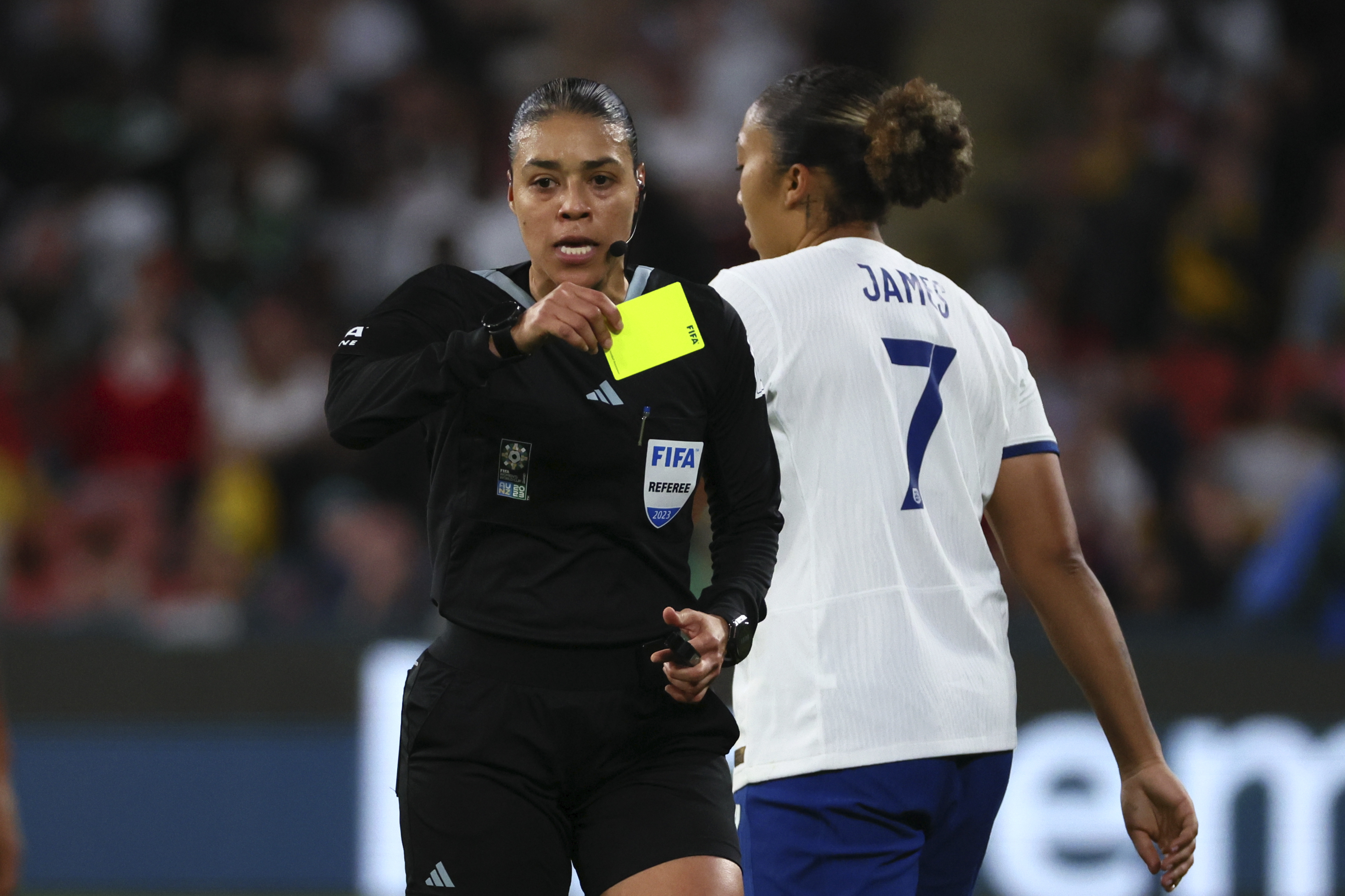 Referee Melissa Borjas shows a yellow card to England's Lauren James during the Women's World Cup round of 16 soccer match between England and Nigeria in Brisbane, Australia, Monday, Aug. 7, 2023.