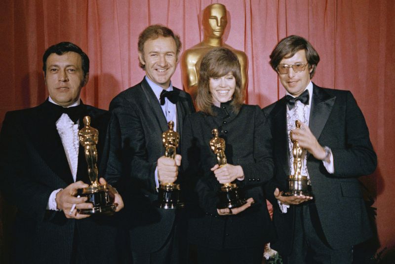 William Friedkin, winner of the award for best achievement in directing for "The French Connection," from right, Jane Fonda, winner of the best actress award for "Klute," Gene Hackman, winner of the best actor award for "The French Connection" and producer Philip D'Antoni, winner of the award for best picture for "The French Connection," pose in the press room at the Academy Awards, March 27, 1971, in Los Angeles. Friedkin died Monday in Los Angeles, his wife, producer and former studio head Sherry Lansing told The Hollywood Reporter.