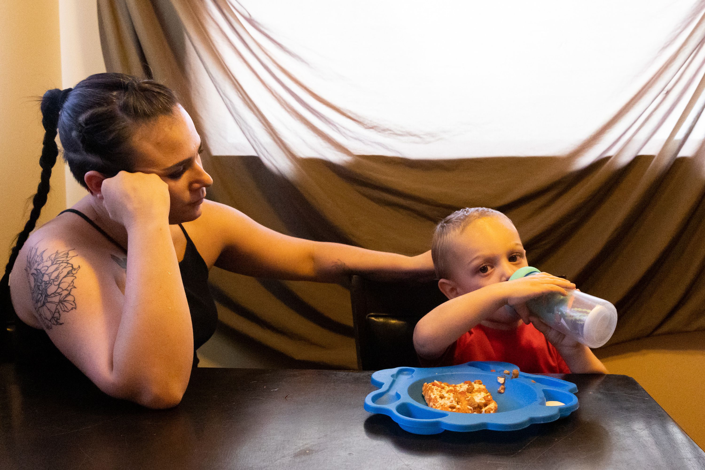 Tristen Parson feeds her son Enzo, 2, at her home in Ogden on Sunday.