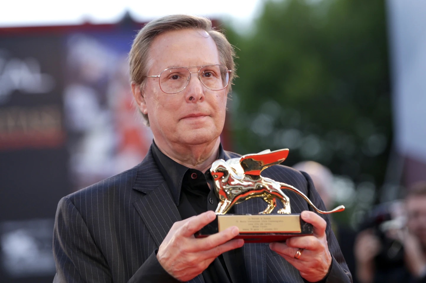 Director William Friedkin poses with his Golden Lion Lifetime Achievement award at the 70th edition of the Venice Film Festival in Venice, Italy, on Aug. 29, 2013. Friedkin, who won the best director Oscar for “The French Connection,” died Monday in Los Angeles, his wife, producer and former studio head Sherry Lansing told The Hollywood Reporter.