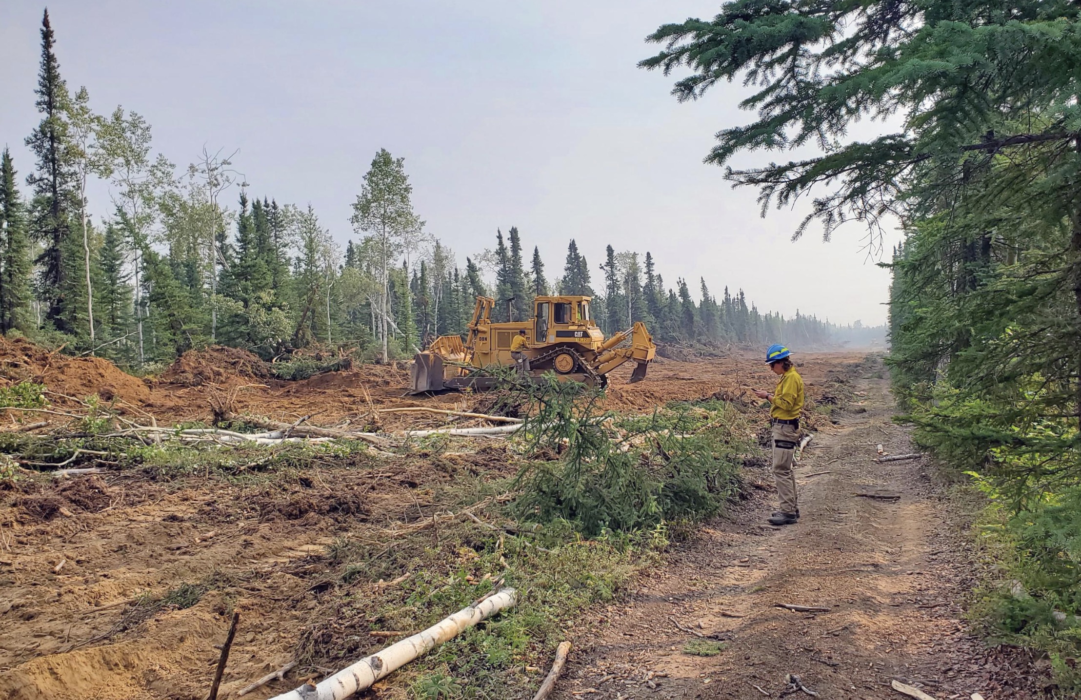 Firefighters work on a fuel break south of Anderson, Alaska, on Monday. Three Orem firefighters were dispatched to the Anderson Complex fires, city officials said Monday.