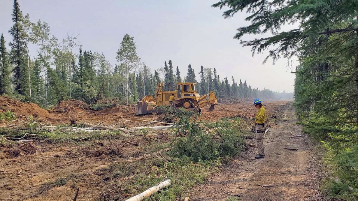 Firefighters work on a fuel break south of Anderson, Alaska, on Monday. Three Orem firefighters were dispatched to the Anderson Complex fires, city officials said Monday.