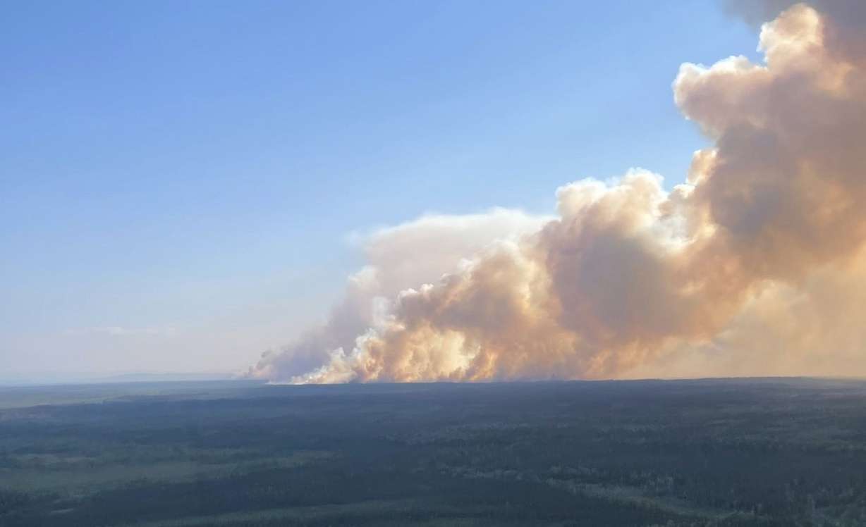 A smoke column from the Anderson Complex fires is pictured on Saturday.