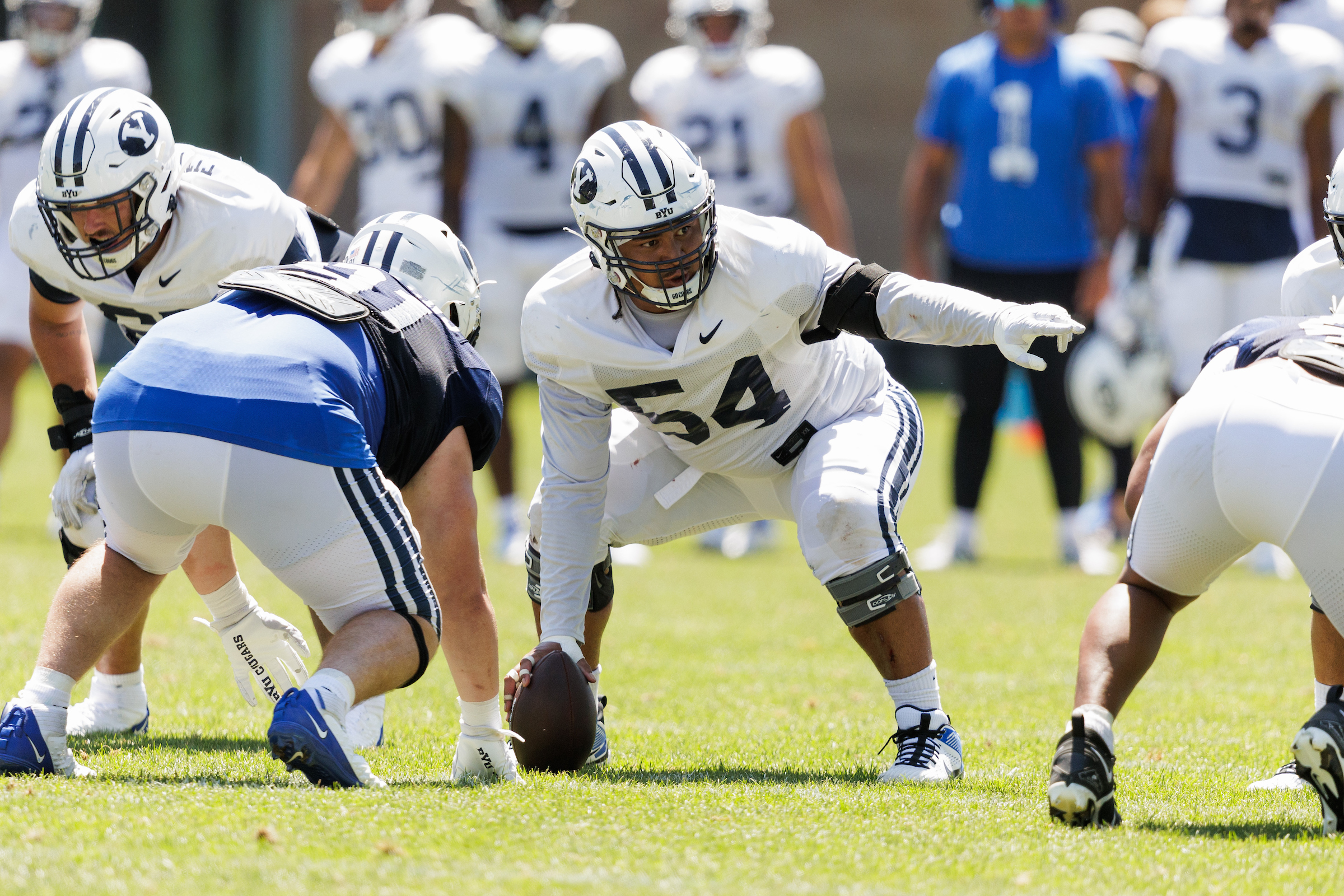 BYU center Paul Maile signals before the snap during football fall camp, Monday, Aug. 7, 2023 in Provo, Utah.