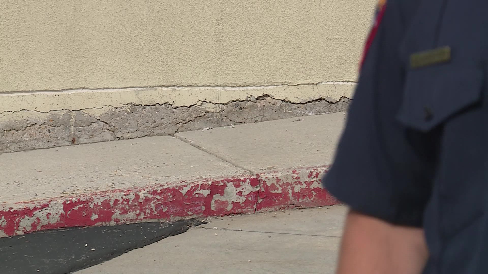 Cracks show in the old Sandy fire station foundation Monday in Sandy.