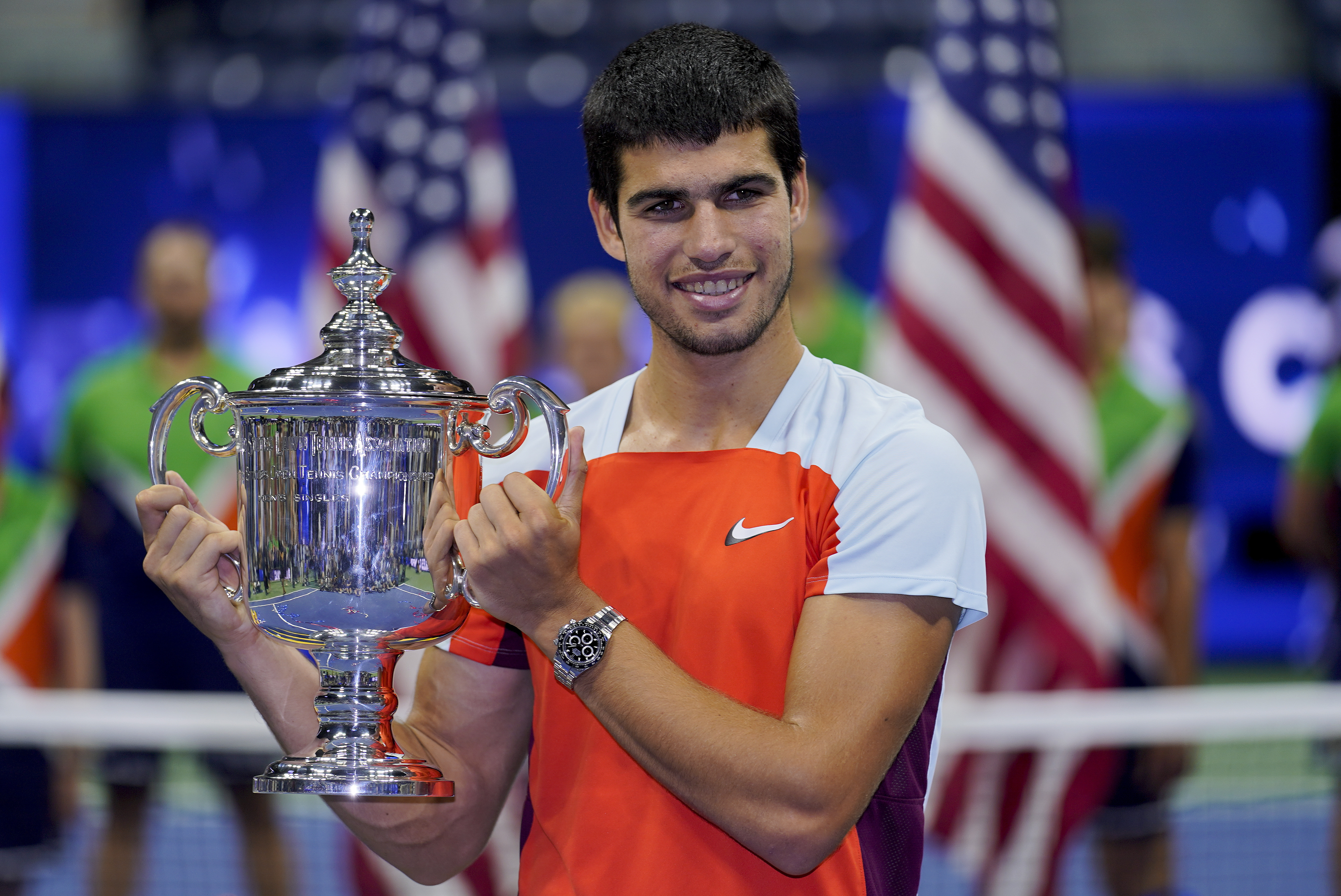 FILE - Carlos Alcaraz, of Spain, holds up the championship trophy after defeating Casper Ruud, of Norway, in the men's singles final of the U.S. Open tennis championships, Sunday, Sept. 11, 2022, in New York. Total prize money and player compensation at this year’s U.S. Open tennis tournament will reach a record $65 million, the U.S. Tennis Association said Tuesday, Aug. 8, 2023, noting that number is boosted by increases in the amount of expenses covered.