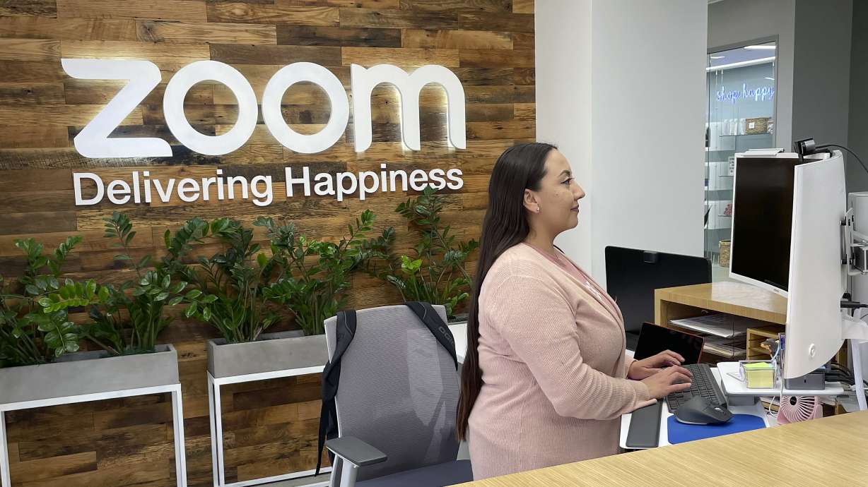 A woman works at Zoom headquarters on Feb. 3 in San Jose, Calif. Zoom is asking employees who live within a 50-mile radius of its offices to work onsite two days a week.
