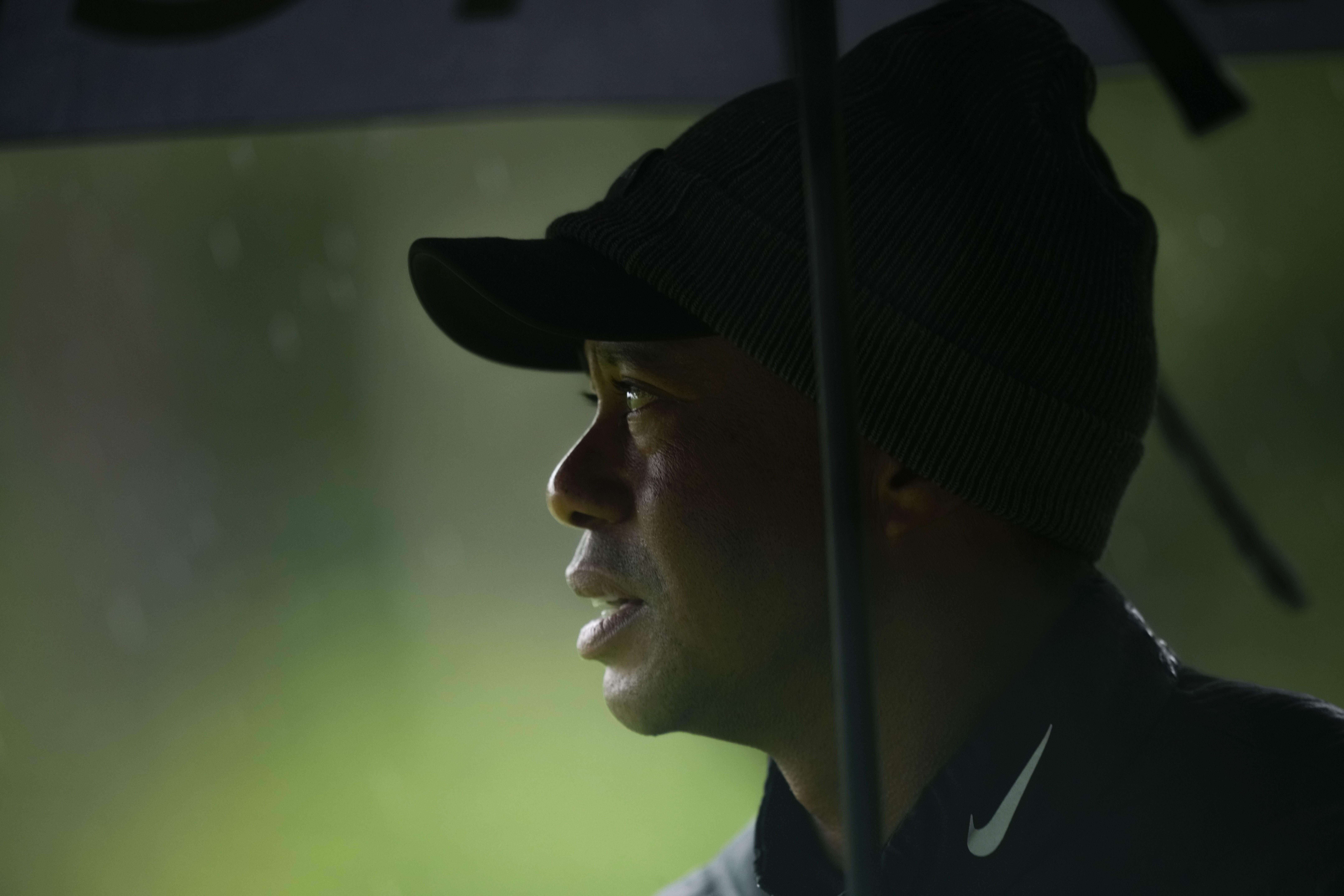FILE - Tiger Woods watches on the 13th hole during the weather delayed third round of the Masters golf tournament at Augusta National Golf Club on April 8, 2023, in Augusta, Ga. Tiger Woods has joined the PGA Tour policy board for the first time in his 27 years. He has given Commissioner Jay Monahan key support and the players a greater voice as the tour tries to complete its business partnership with the Saudi backers of LIV Golf. Woods is joining as a sixth player director on the board.