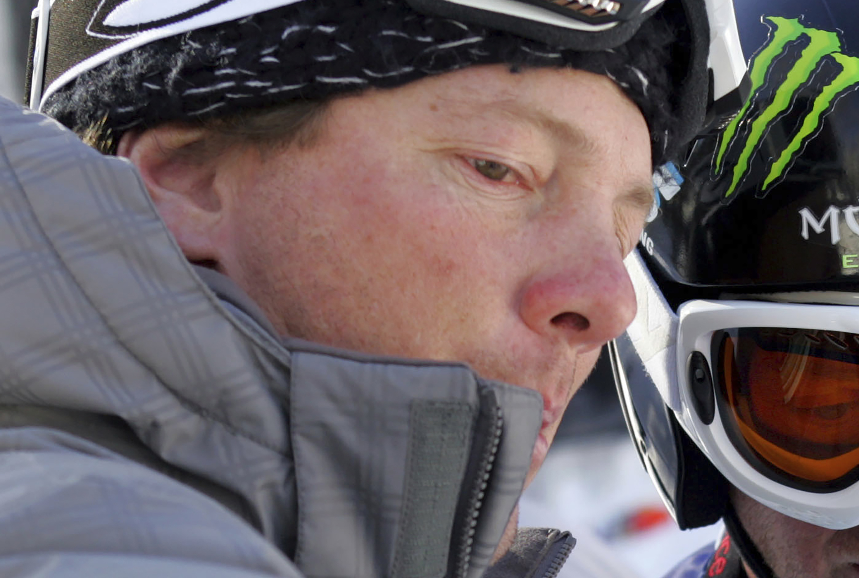 FILE - Coach Peter Foley, left, goes over some instructions with a skier/snowboarder near the start of the skier cross at the 11th Winter X Games at Buttermilk Ski Area near Aspen, Colo., Jan. 26, 2007. Foley was suspended by the U.S. Center for SafeSport on Tuesday, Aug. 8, 2023, for sexual misconduct and violating policies at U.S. Ski and Snowboard. Foley’s suspension came after a near 18-month investigation that stemmed from an Instagram post by a former team member during last year’s Winter Olympics. 