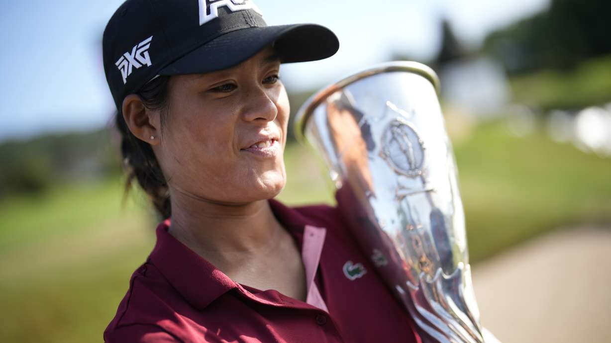 France's Celine Boutier poses with her trophy after winning the Evian Championship women's golf tournament in Evian, eastern France, Sunday, July 30, 2023.