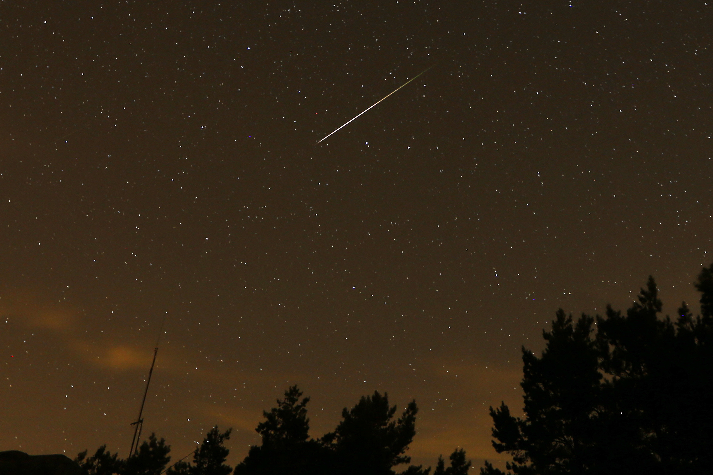 A streak appears in the sky during the annual Perseid meteor shower at the Guadarrama mountains, near Madrid, in the early hours of Aug. 12, 2016. The best viewing for the annual shower visible around the world will be from Saturday night into early Sunday morning. 