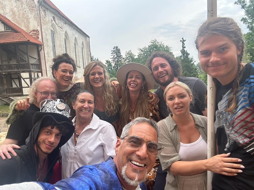 Jakob Von Rosen Imig, of Utah, and his friends stand beside the flagpole at the Lielstraupe castle in Cesis, Latvia.
