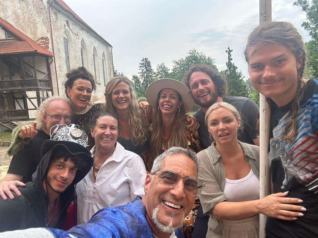 Jakob Von Rosen Imig, of Utah, and his friends stand beside the flagpole at the Lielstraupe castle in Cesis, Latvia.