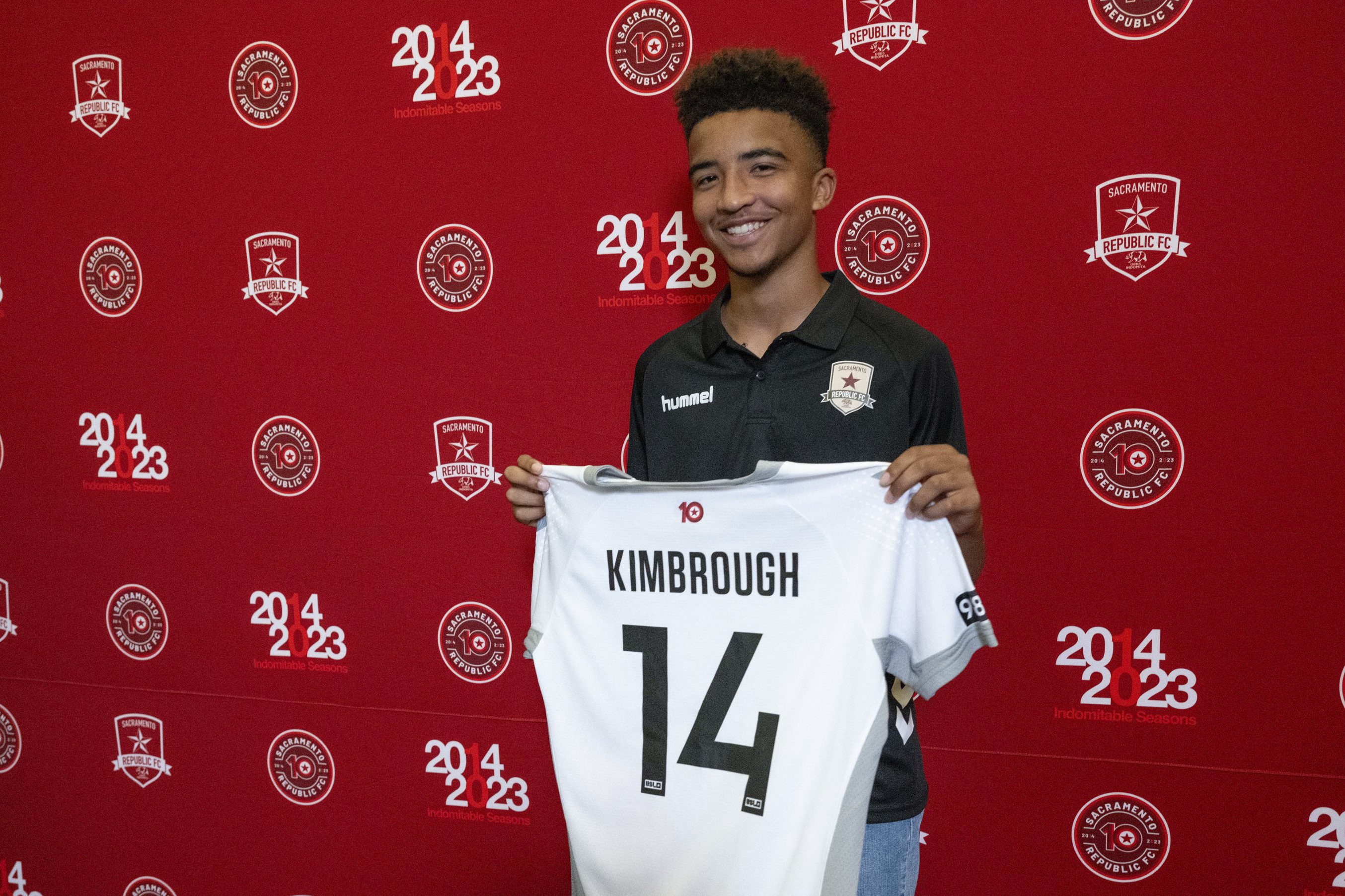 Da'vian Kimbrough, 13, holds up his jersey after signing contract with the Sacramento Republic of the second-tier League Championship of the United Soccer League, Tuesday, Aug. 8, 2023, in Sacramento, Calif. 