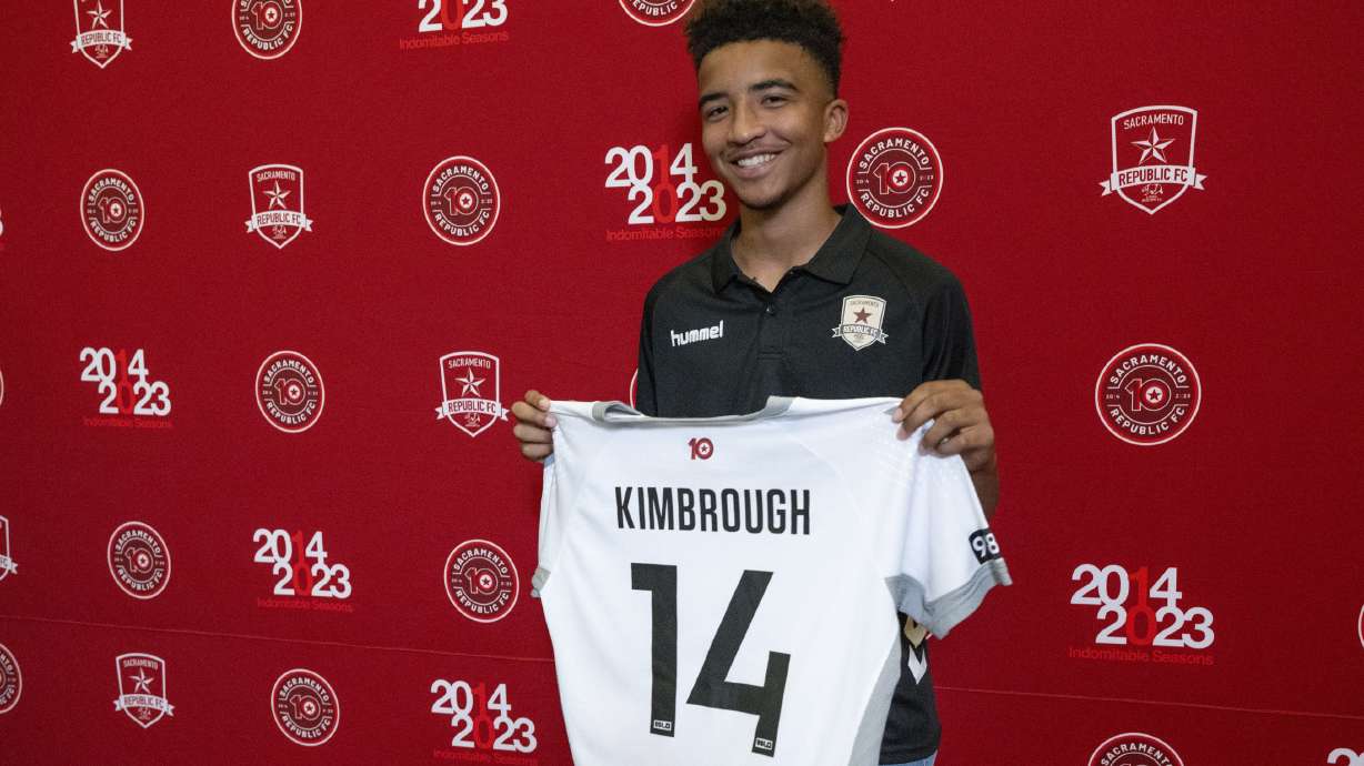 Da'vian Kimbrough, 13, holds up his jersey after signing contract with the Sacramento Republic of the second-tier League Championship of the United Soccer League, Tuesday, Aug. 8, 2023, in Sacramento, Calif.
