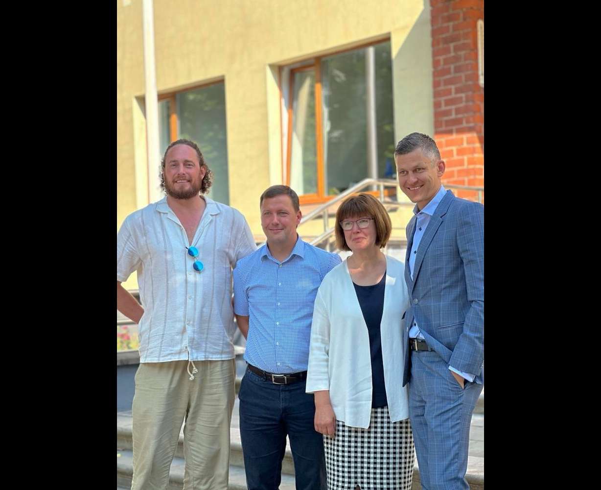 Jakob von Rosen Imig, Mayor Jānis Rozenbergs, castle curator Rudite Vasile and von Rosen's attorney Armands Rasa stand in front of the Lielstraupe castle in Cesis, Latvia.