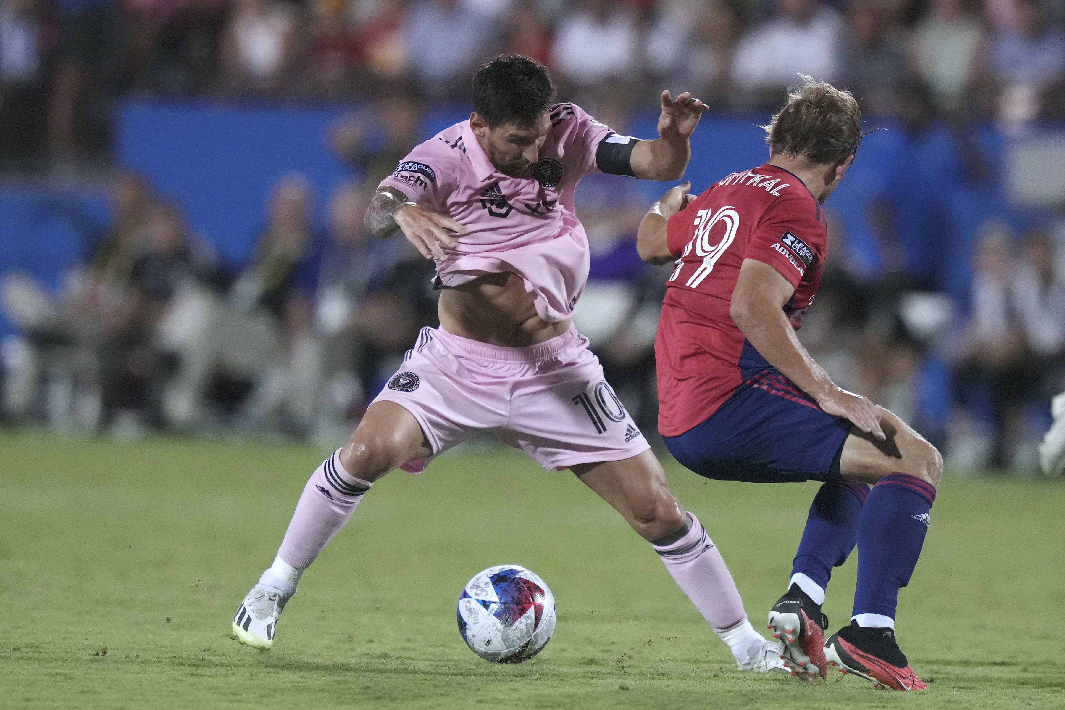Inter Miami forward Lionel Messi (10) gets around FC Dallas midfielder Paxton Pomykal (19) during the second half of a Leagues Cup soccer match Sunday, Aug. 6, 2023, in Frisco, Texas. 