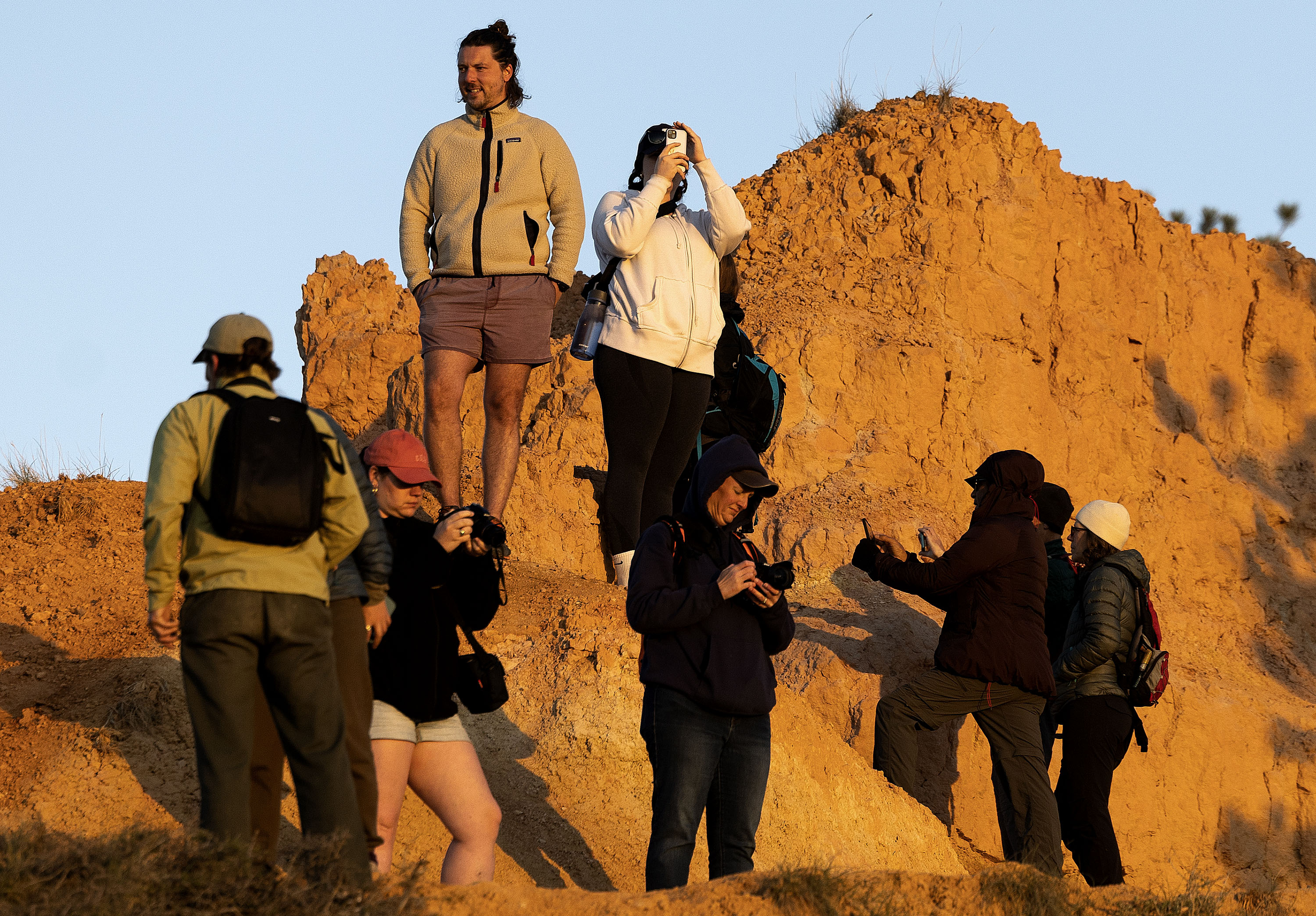 People watch the sunrise at Bryce Canyon National Park on May 18. Utah's tourism industry generated nearly $12 billion in visitor spending last year, according to recent data.