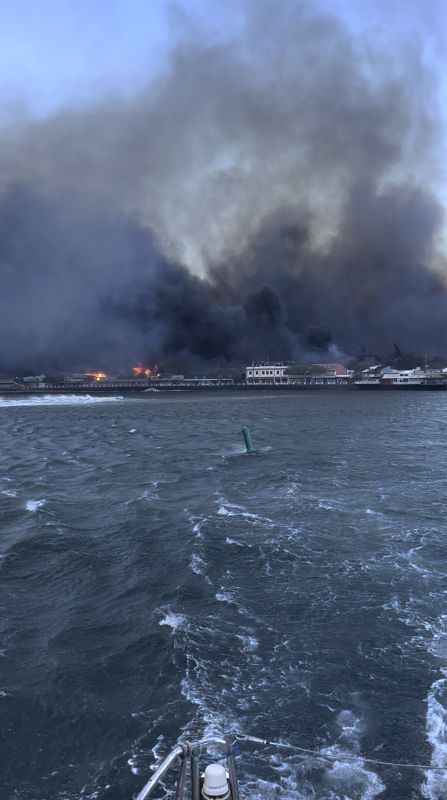 Smoke fills the air from wildfires at Lahaina harbor on Tuesday in Hawaii. Fire was widespread in Lahaina Town, including on Front Street, a popular shopping and dining area, County of Maui spokesperson Mahina Martin said by phone early Wednesday.