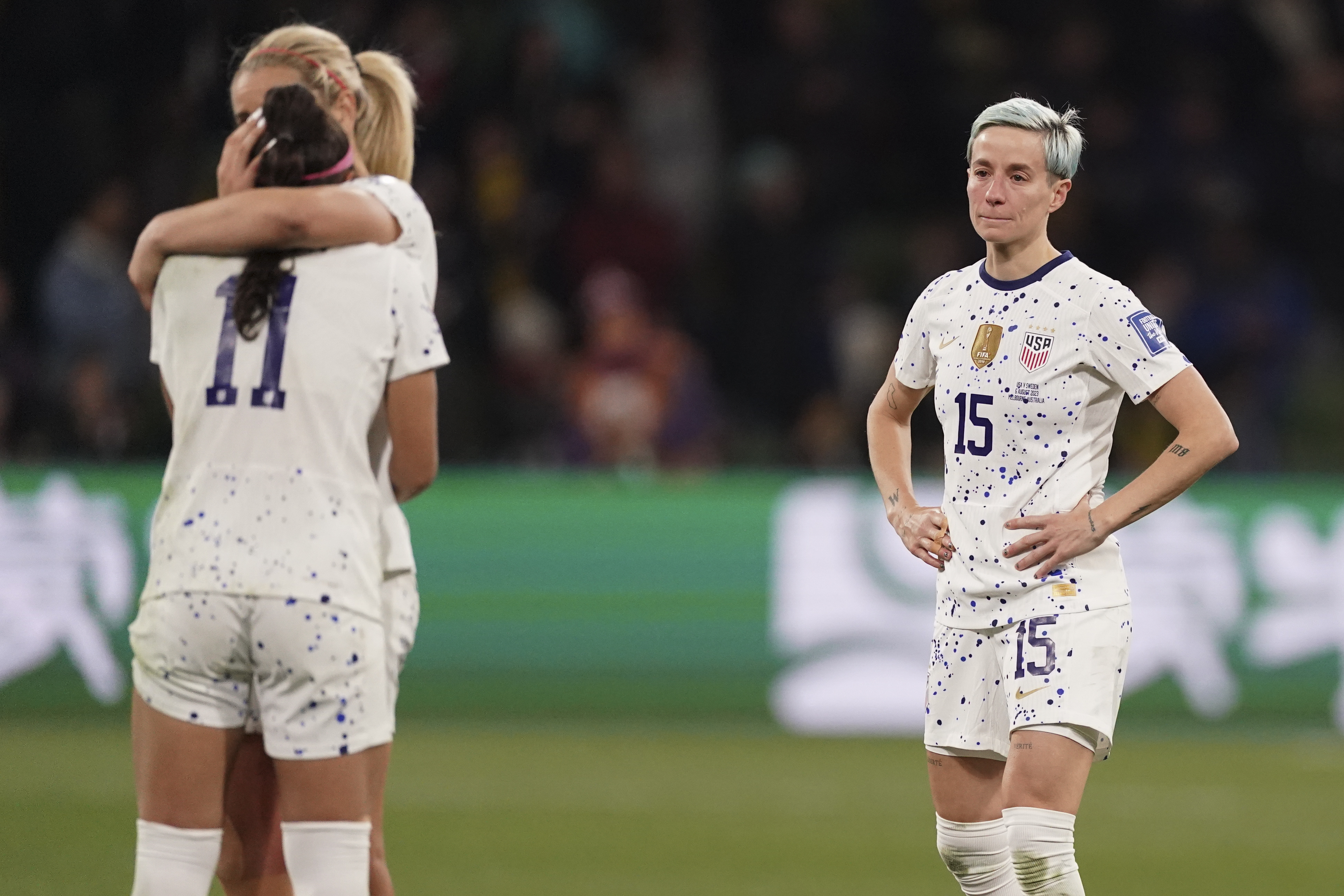 United States' Megan Rapinoe, right, reacts with her teammates following their loss to Sweden in their Women's World Cup round of 16 soccer match in Melbourne, Australia, Sunday, Aug. 6, 2023. 