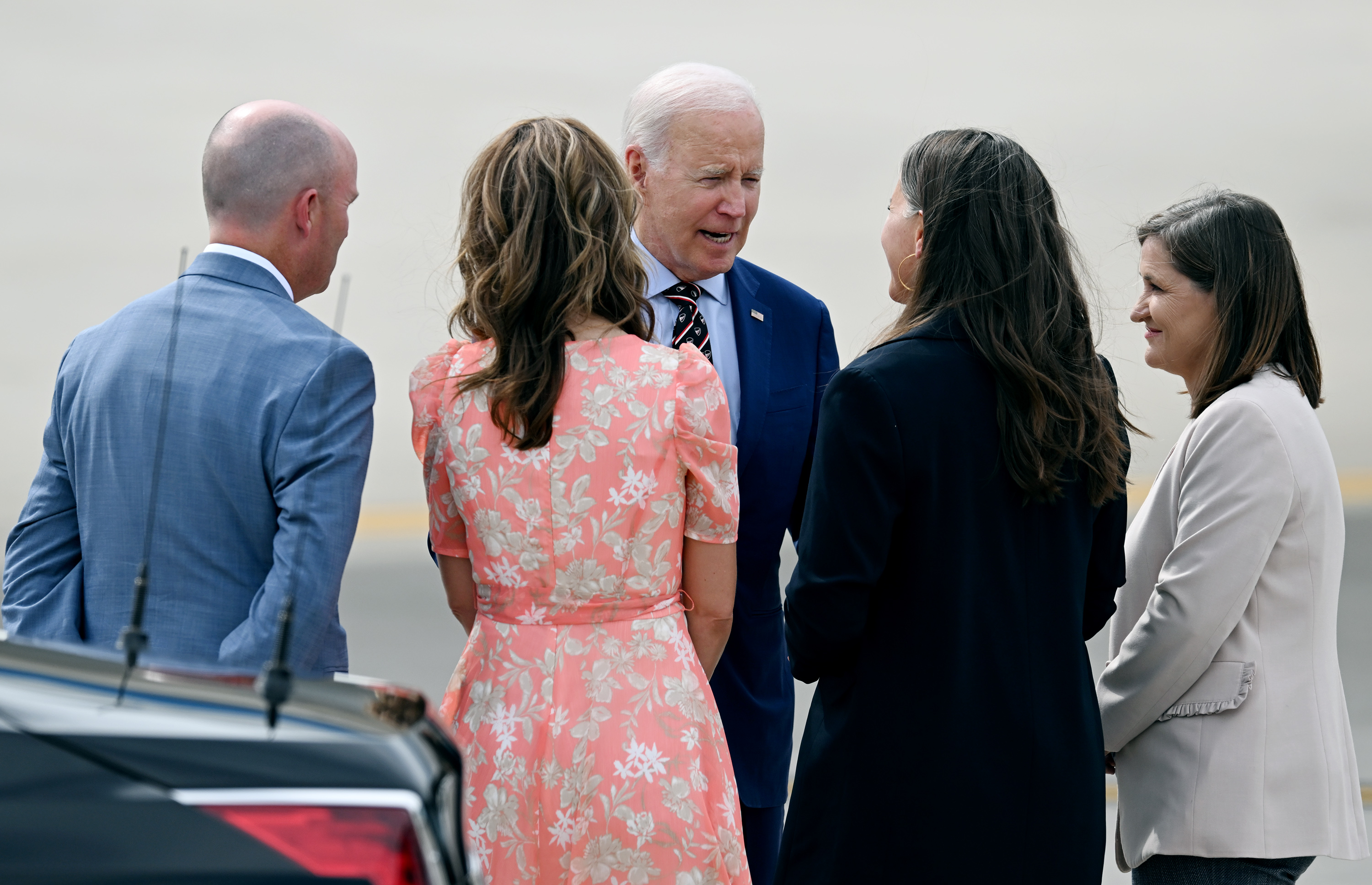 President Joe Biden talks with Governor Spencer Cox, first lady Abby Cox, Salt Lake City Mayor Erin Mendenhall and Salt Lake County Mayor Jenny Wilson after his arrival on Air Force One at Roland R. Wright Air National Guard Base, in Salt Lake City on Wednesday.