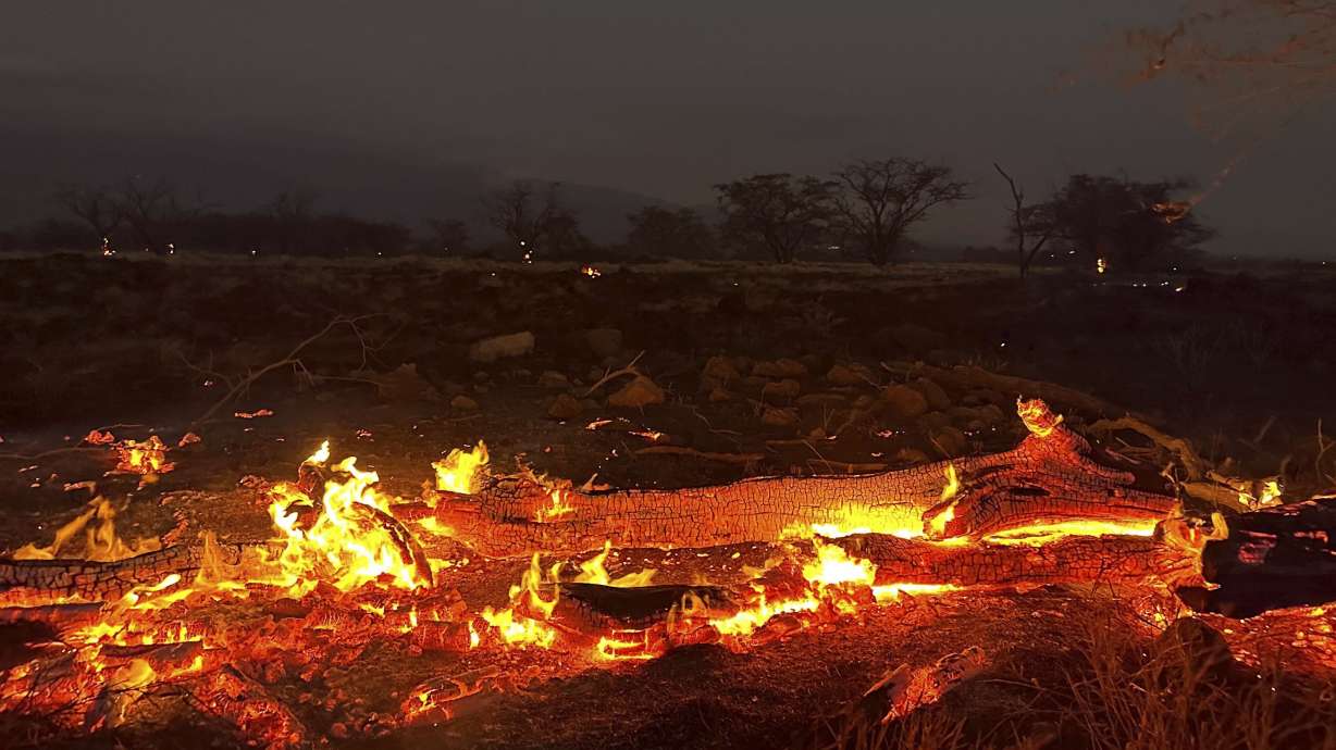 A wildfire burns in Kihei, Hawaii, late Wednesday. Meetinghouses for The Church of Jesus Christ of Latter-day Saints are being used as evacuation shelters for victims there.
