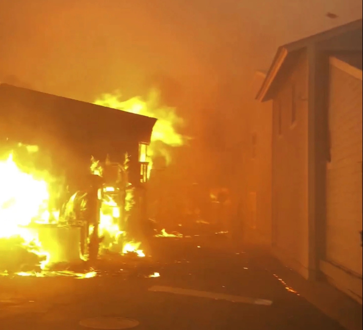 Flames from the wildfires fill the sky on the Front Street in Lahaina, Hawaii, on Tuesday.