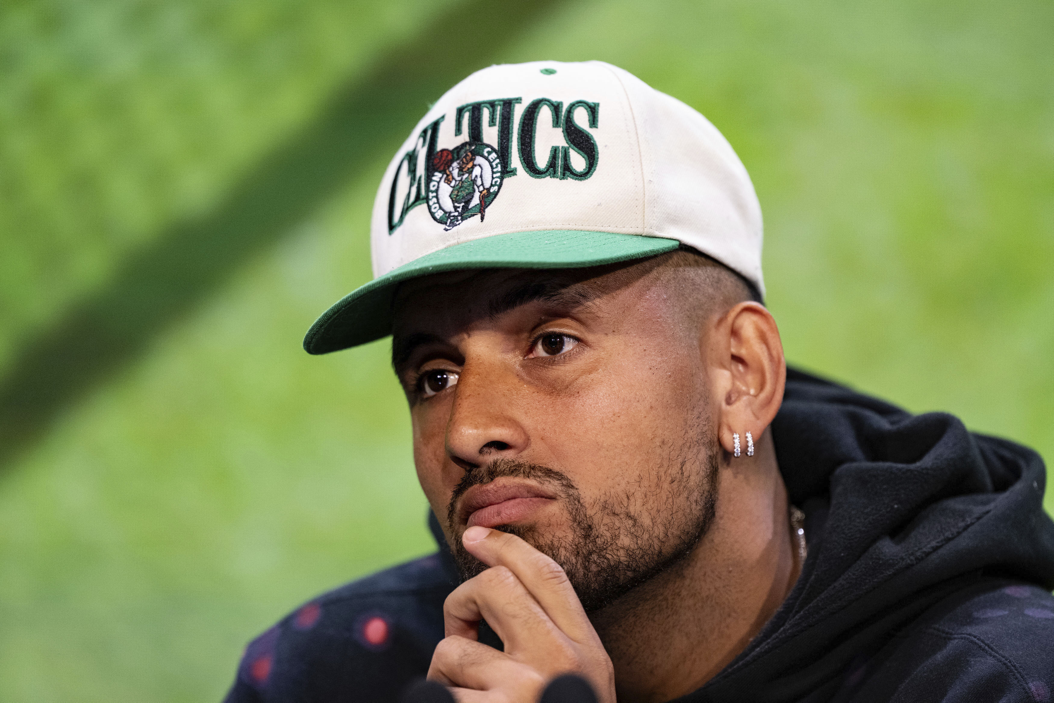 FILE - Australia's Nick Kyrgios listens during a pre-tournament press conference at the All England Lawn Tennis and Croquet Club in Wimbledon, south west London, Sunday July 2, 2023, ahead of the Wimbledon tennis championships. Kyrgios pulled out of the U.S. Open on Thursday, Aug. 101, 2023, meaning he will have missed all four Grand Slam tournaments the year after reaching his first major final. 